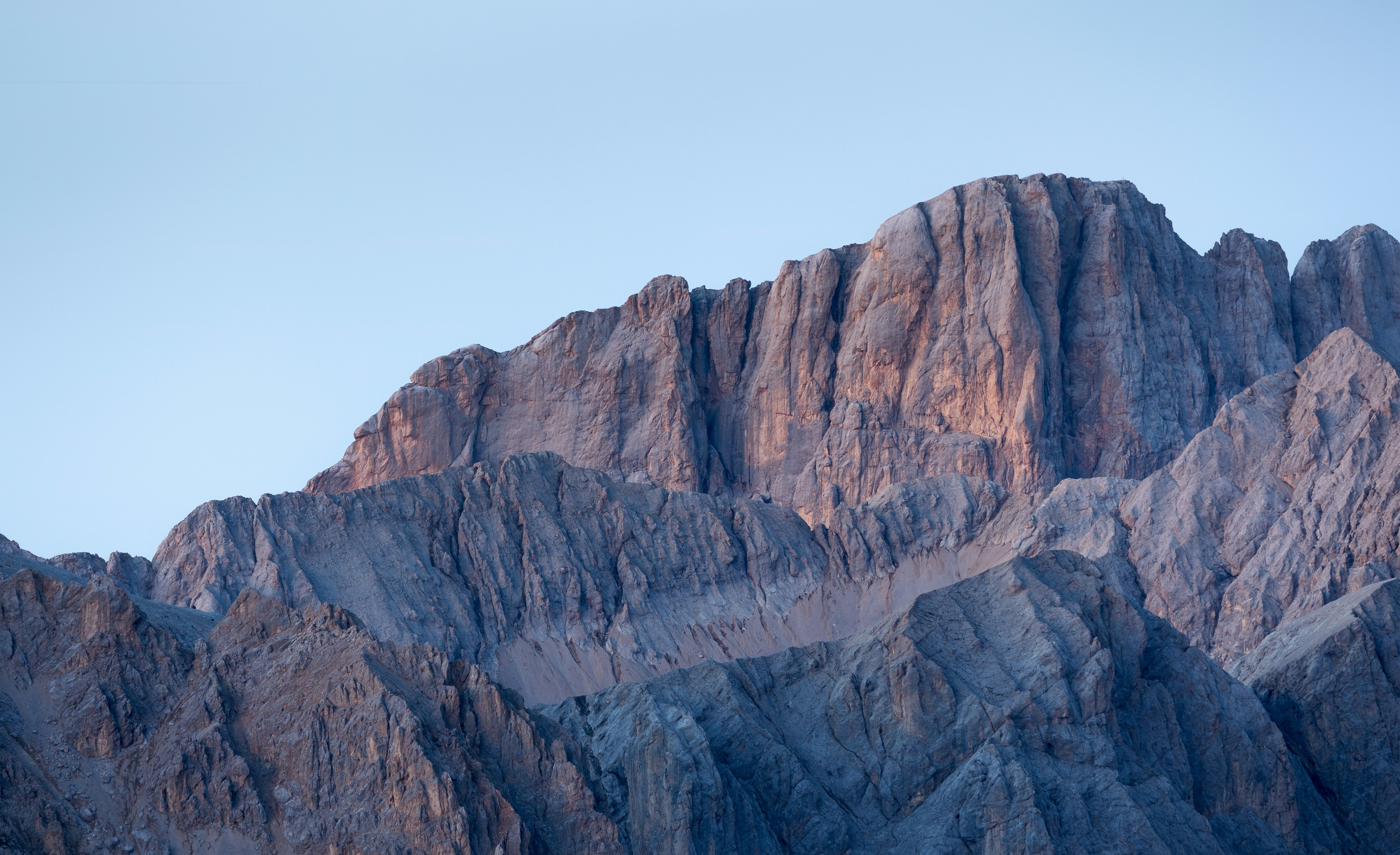 Jagged mountain peaks under a clear sky