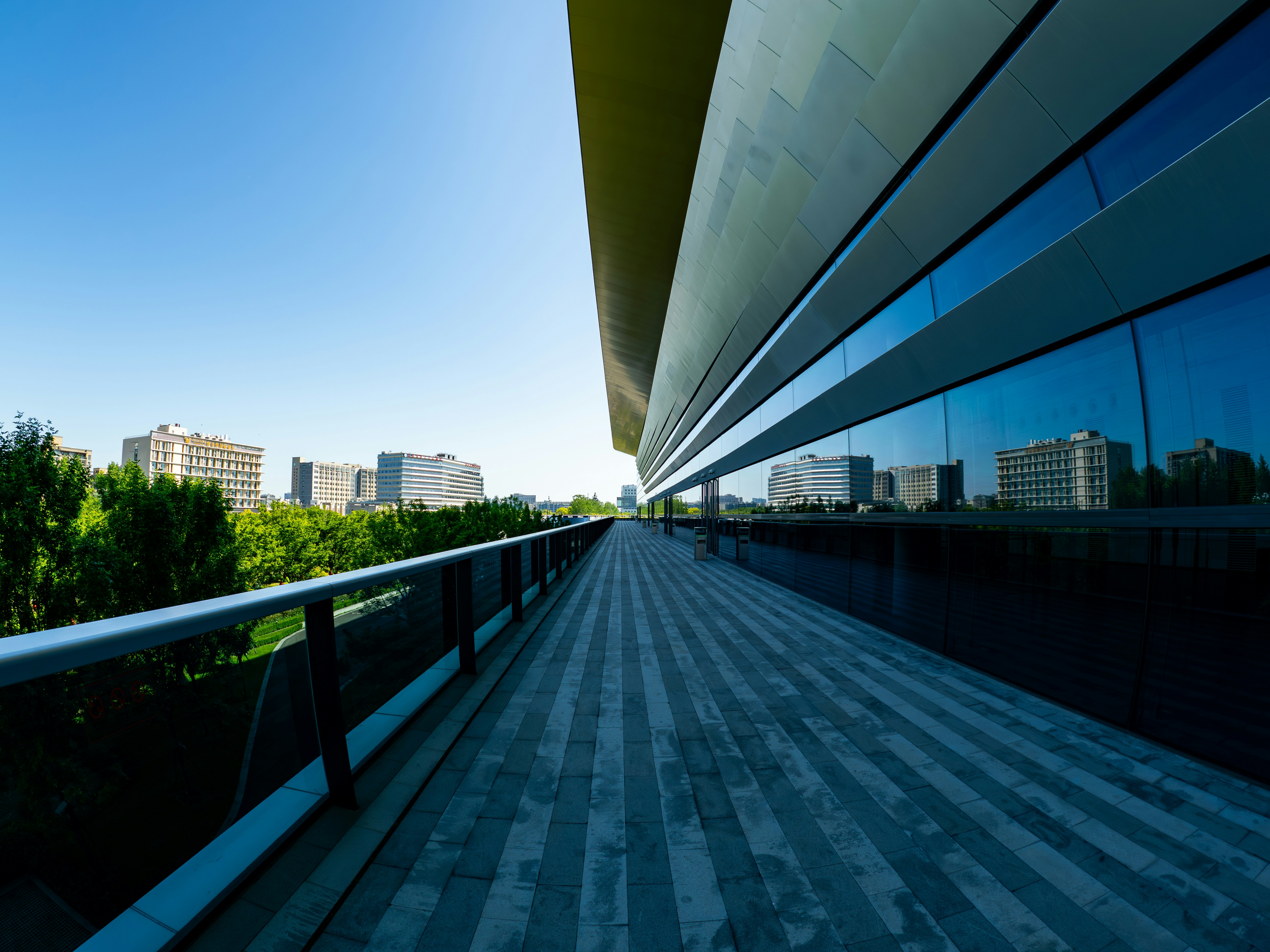 Modern building with reflective windows and walkway