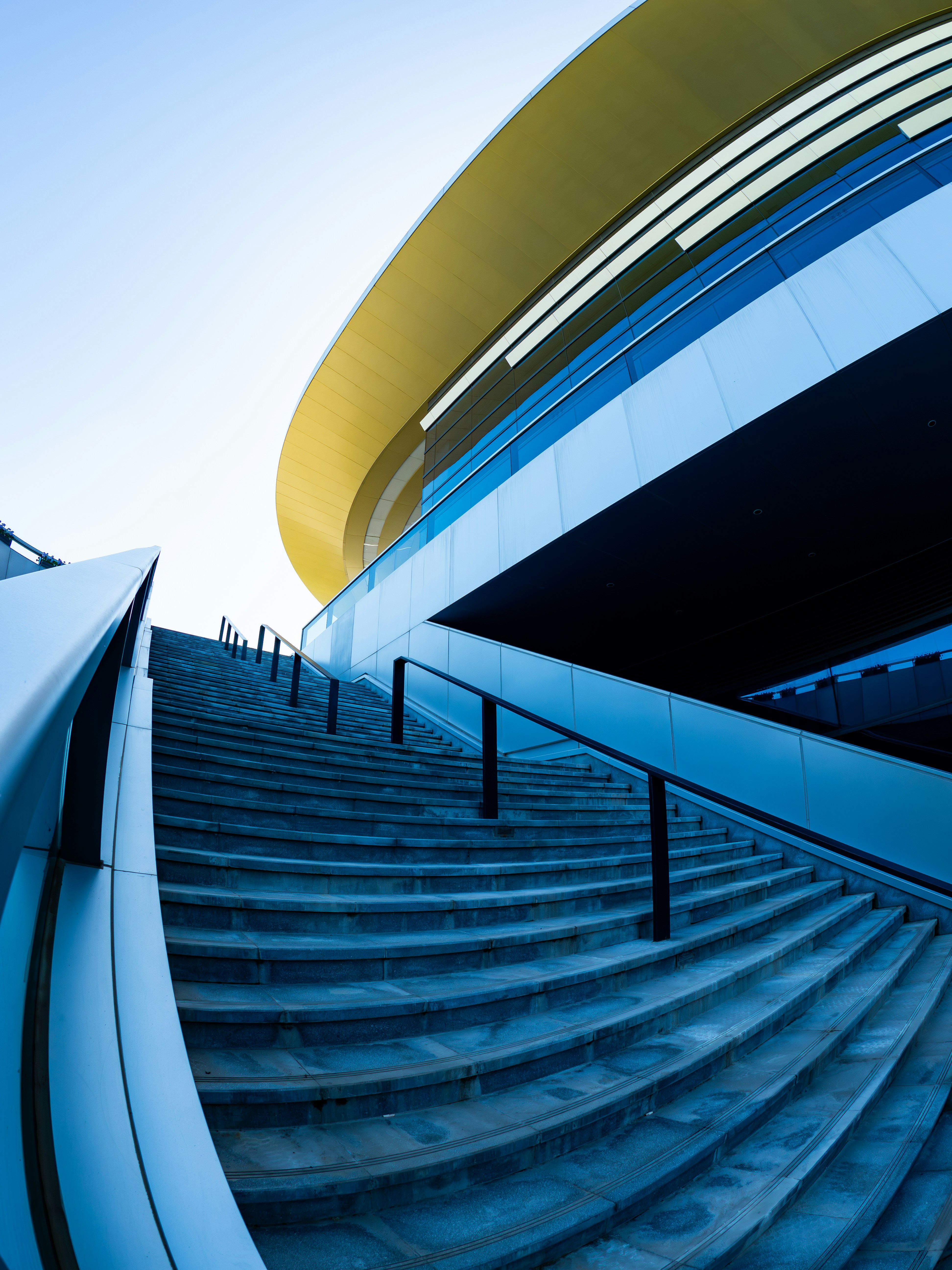 Modern stadium entrance with grand concrete stairs