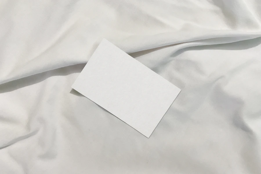 Placeholder: a minimal white brand card on fabric