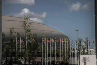 Flags outside a modern domed building