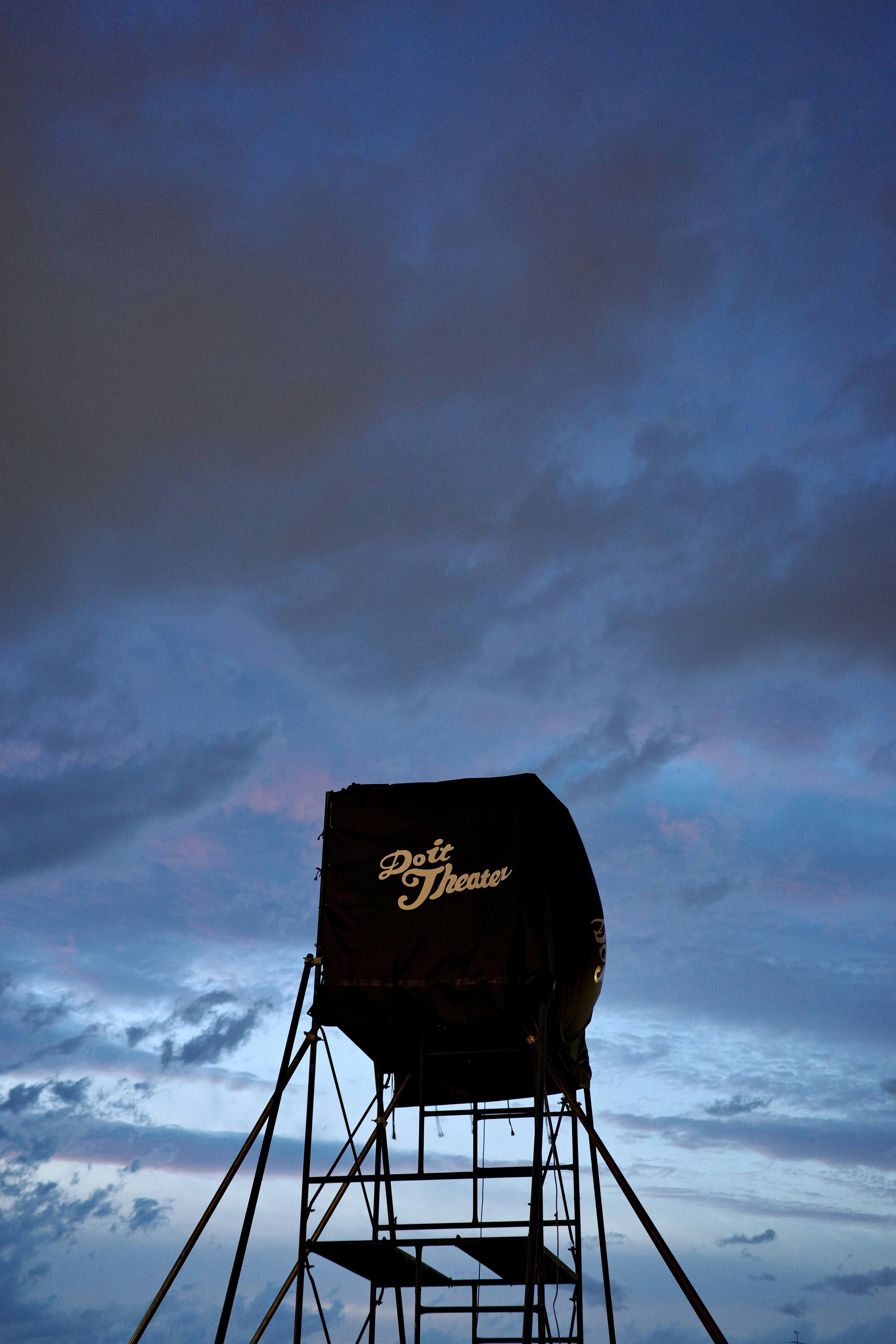 Dark hunting blind against a moody twilight sky