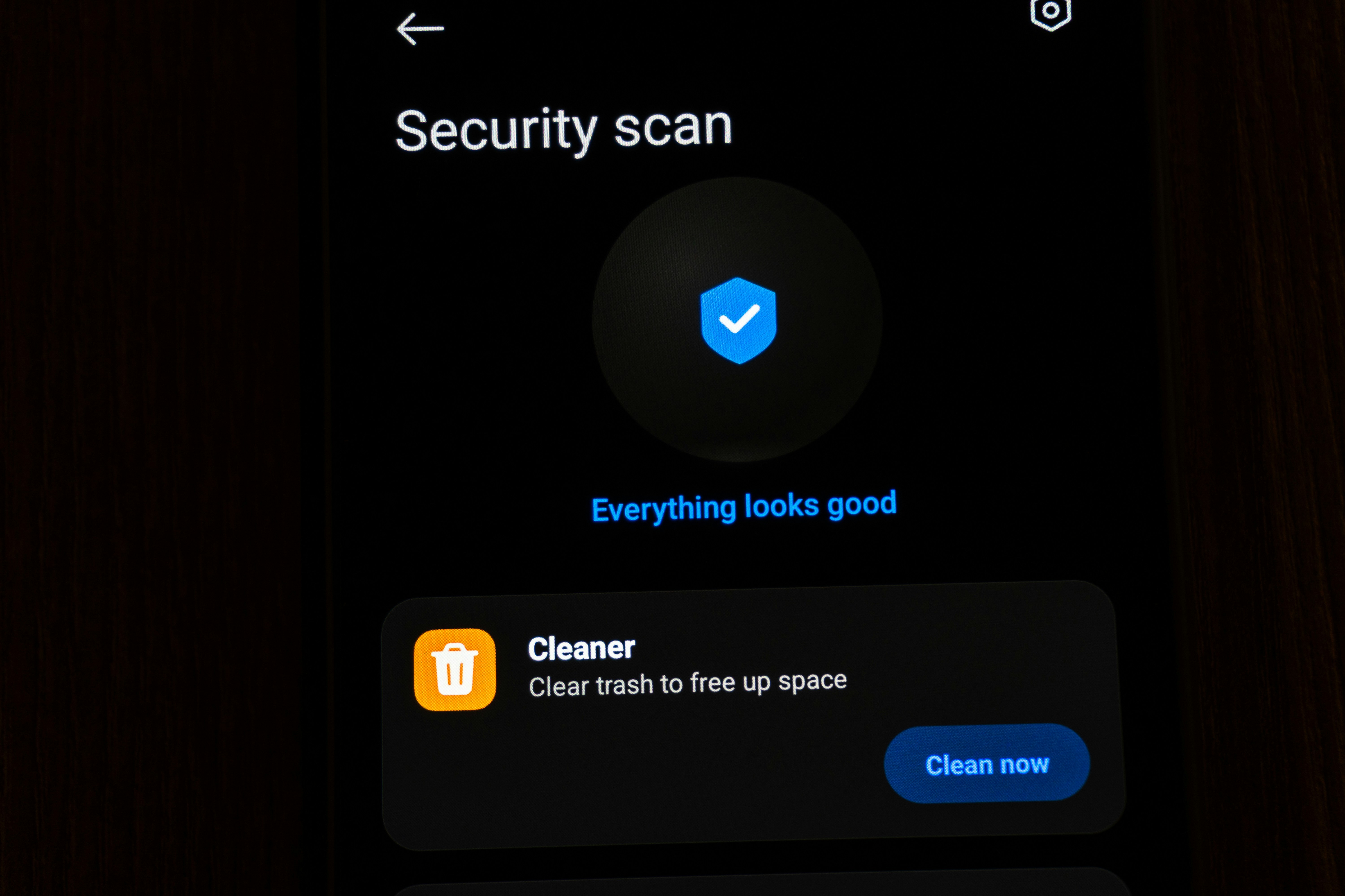 Mobile phone showing a security scan and cleaner interface.