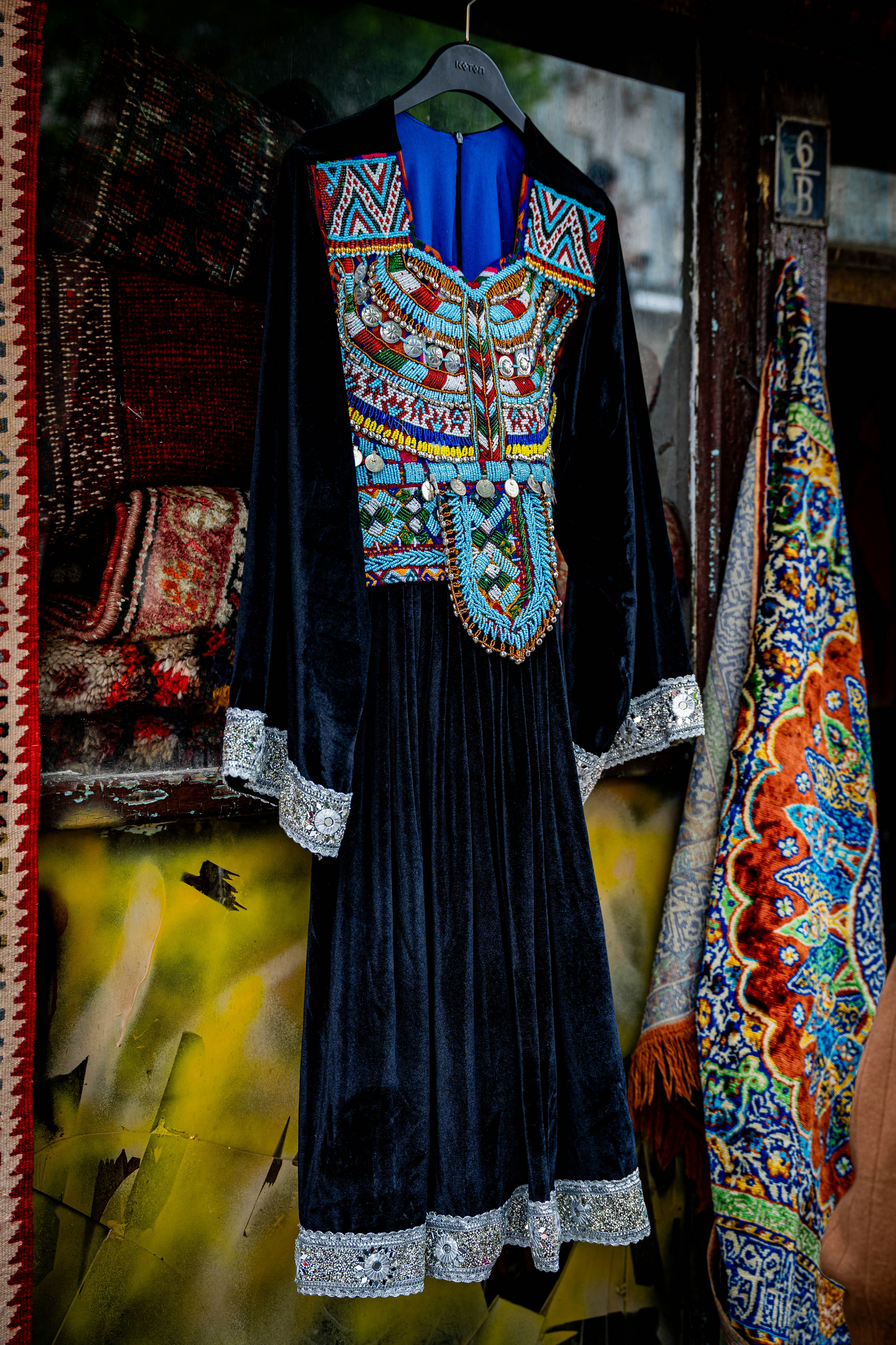 Ornate black velvet dress with colorful embroidered bodice