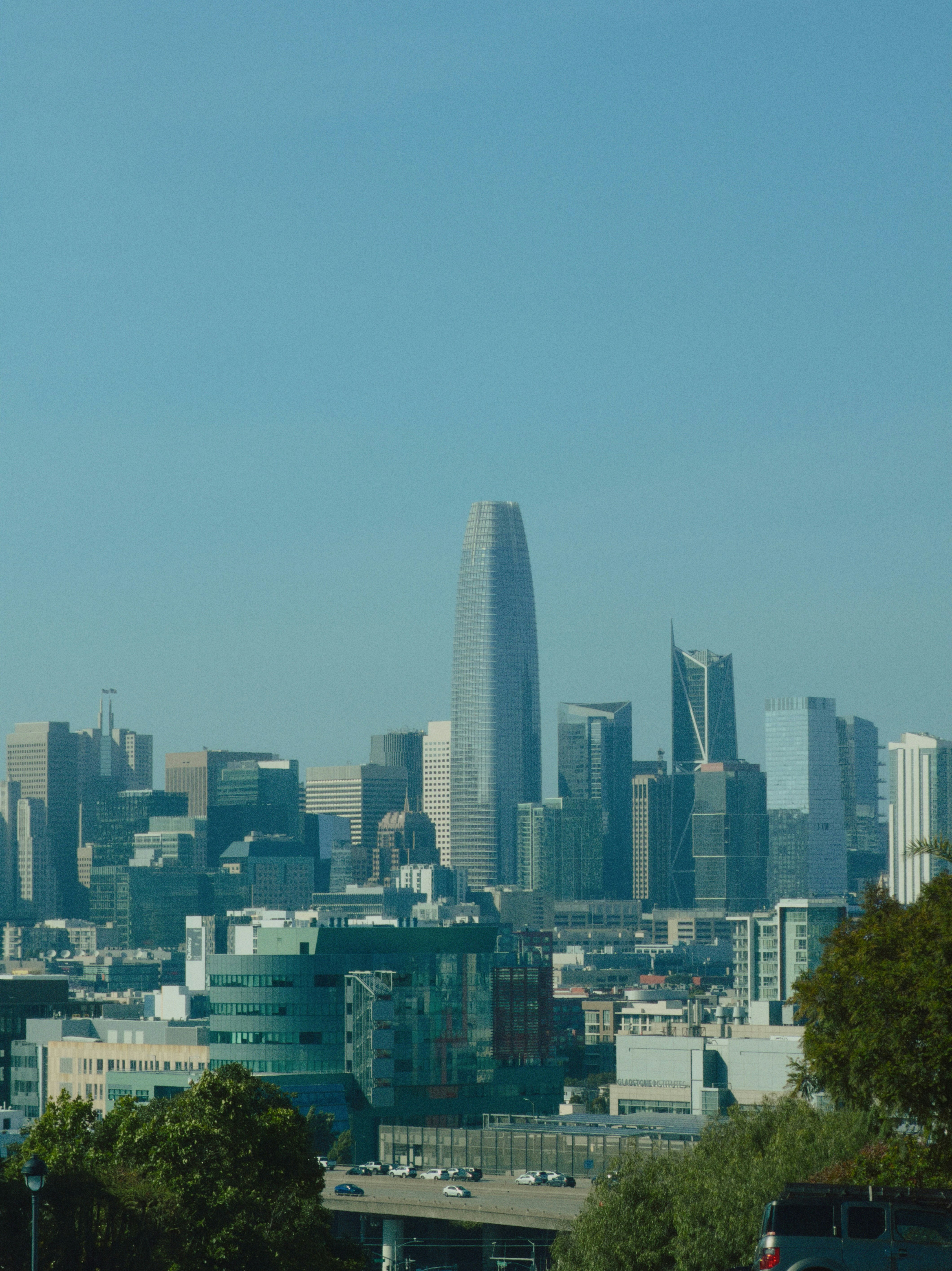 Modern cityscape with tall buildings under a clear sky