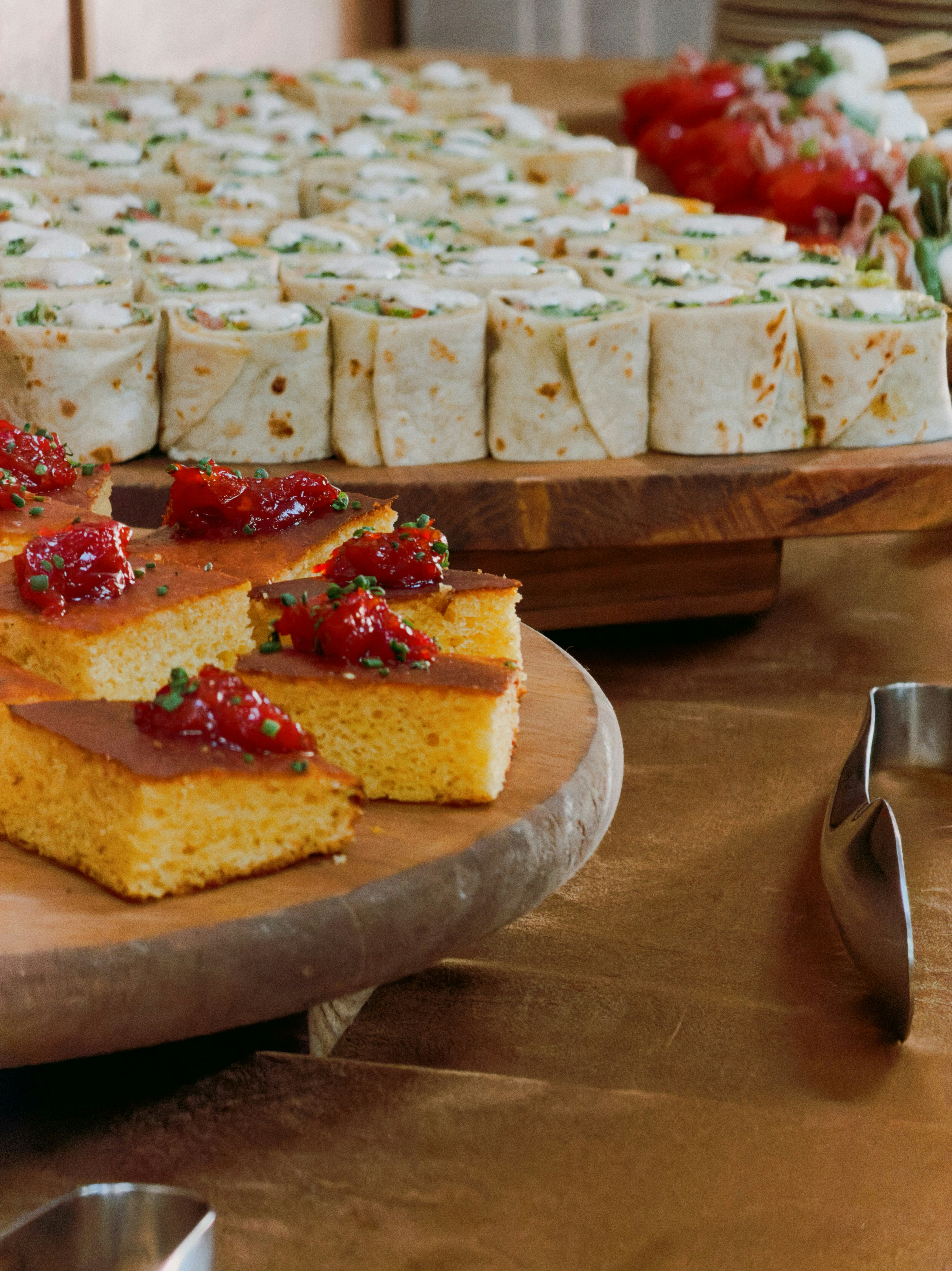 Savory appetizers arranged on wooden platters for a party.