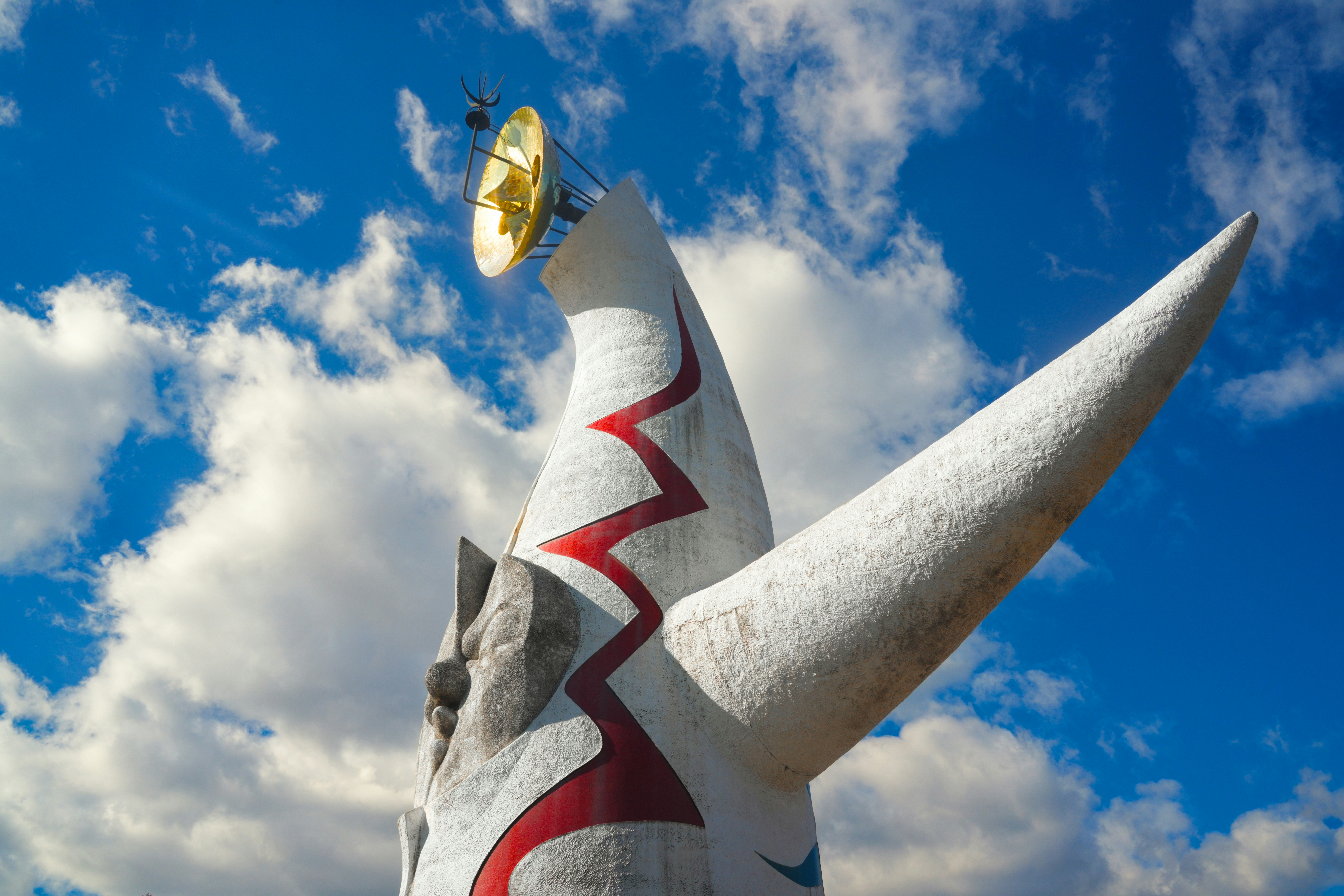 Modern sculpture against a bright blue sky