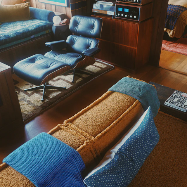 Mid-century modern living room with an Eames chair, wood furniture and a record player