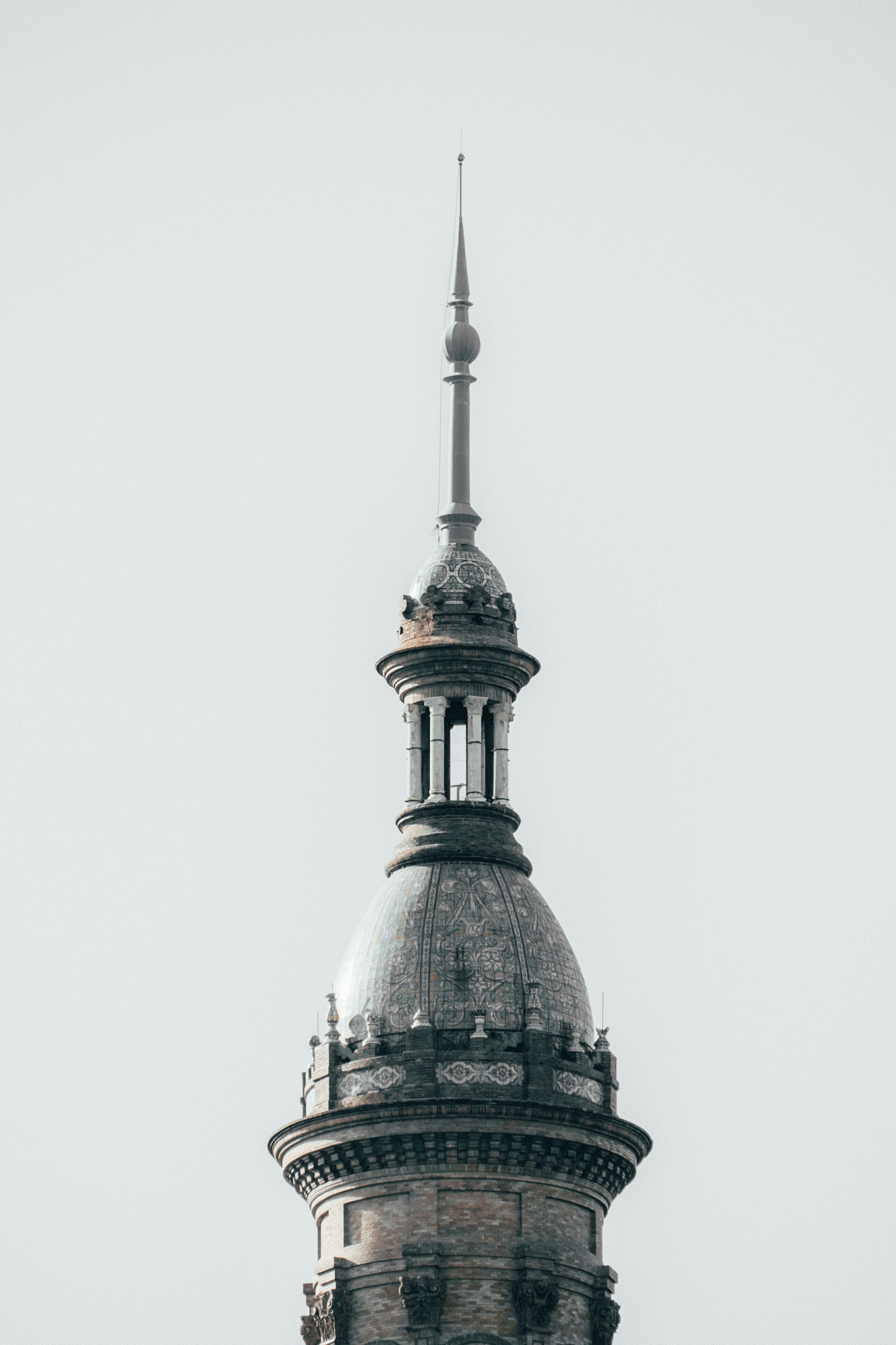 Ornate spire atop an old stone tower