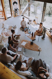 Group meditating in a bright, modern room