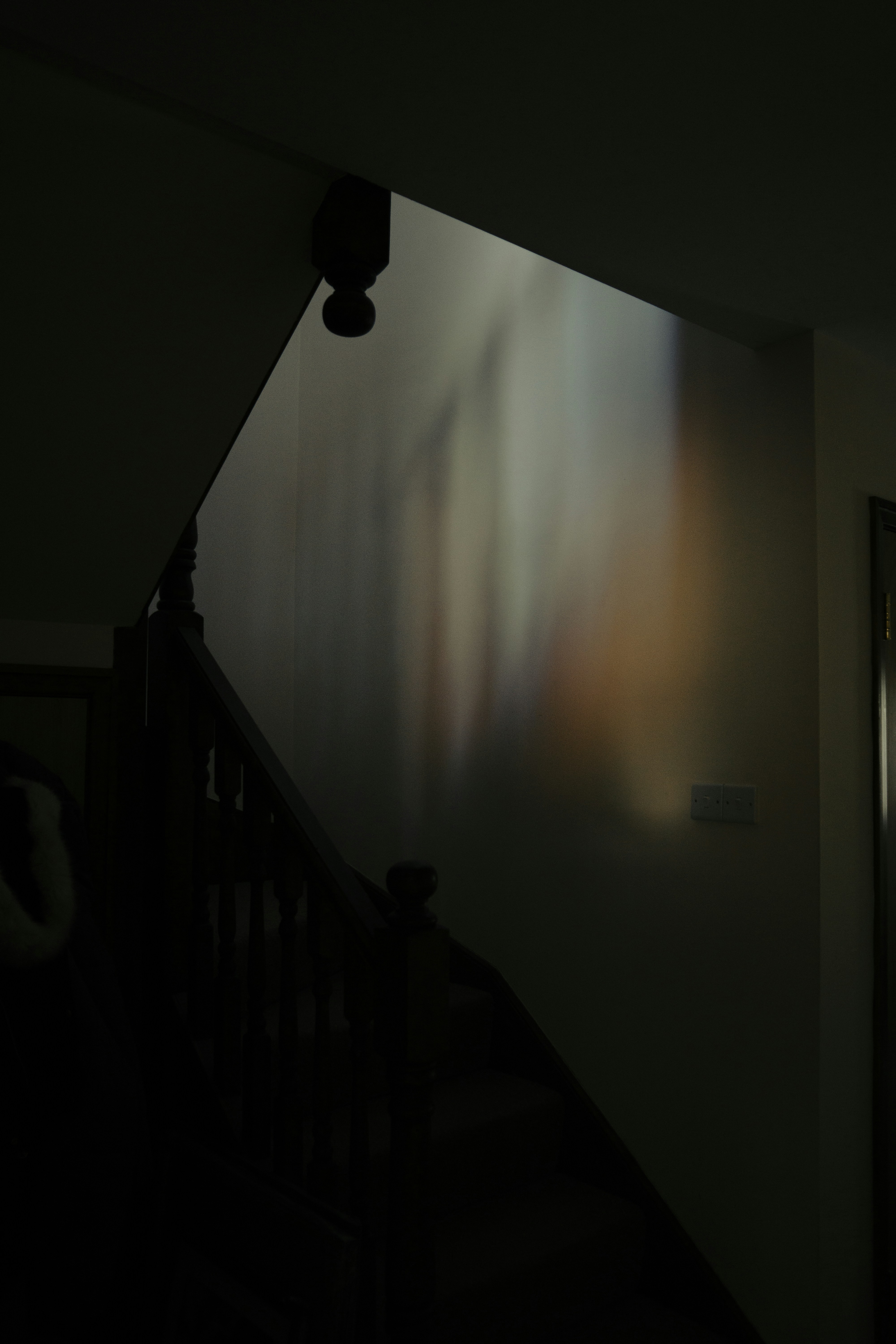 Rainbow light reflections on a wall