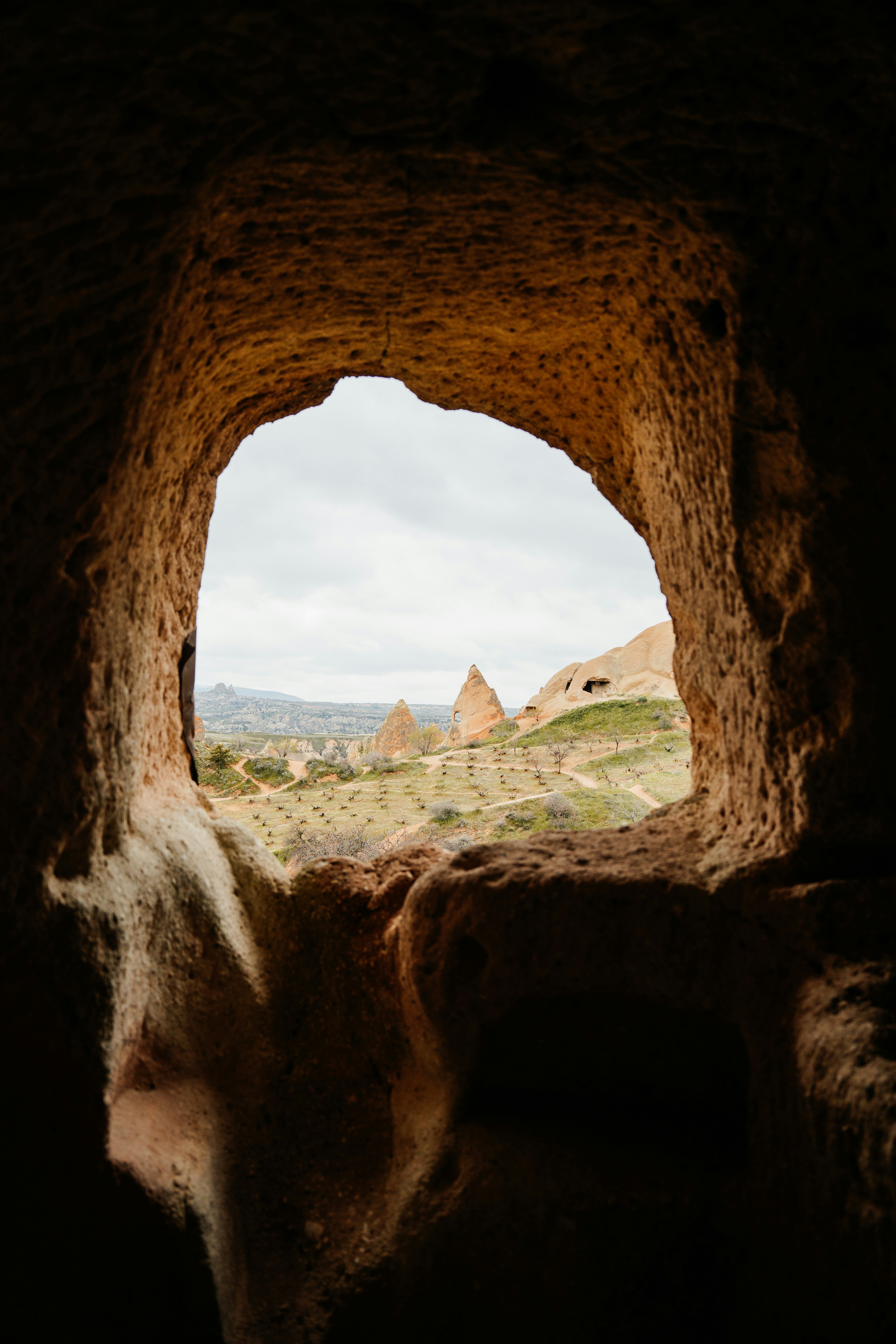 Photo of View of rocky landscape through cave opening by Ahmed