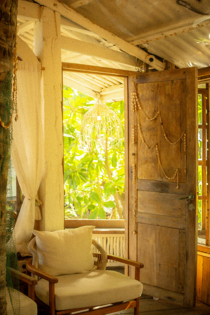 Beach bungalow interior with an open wooden door