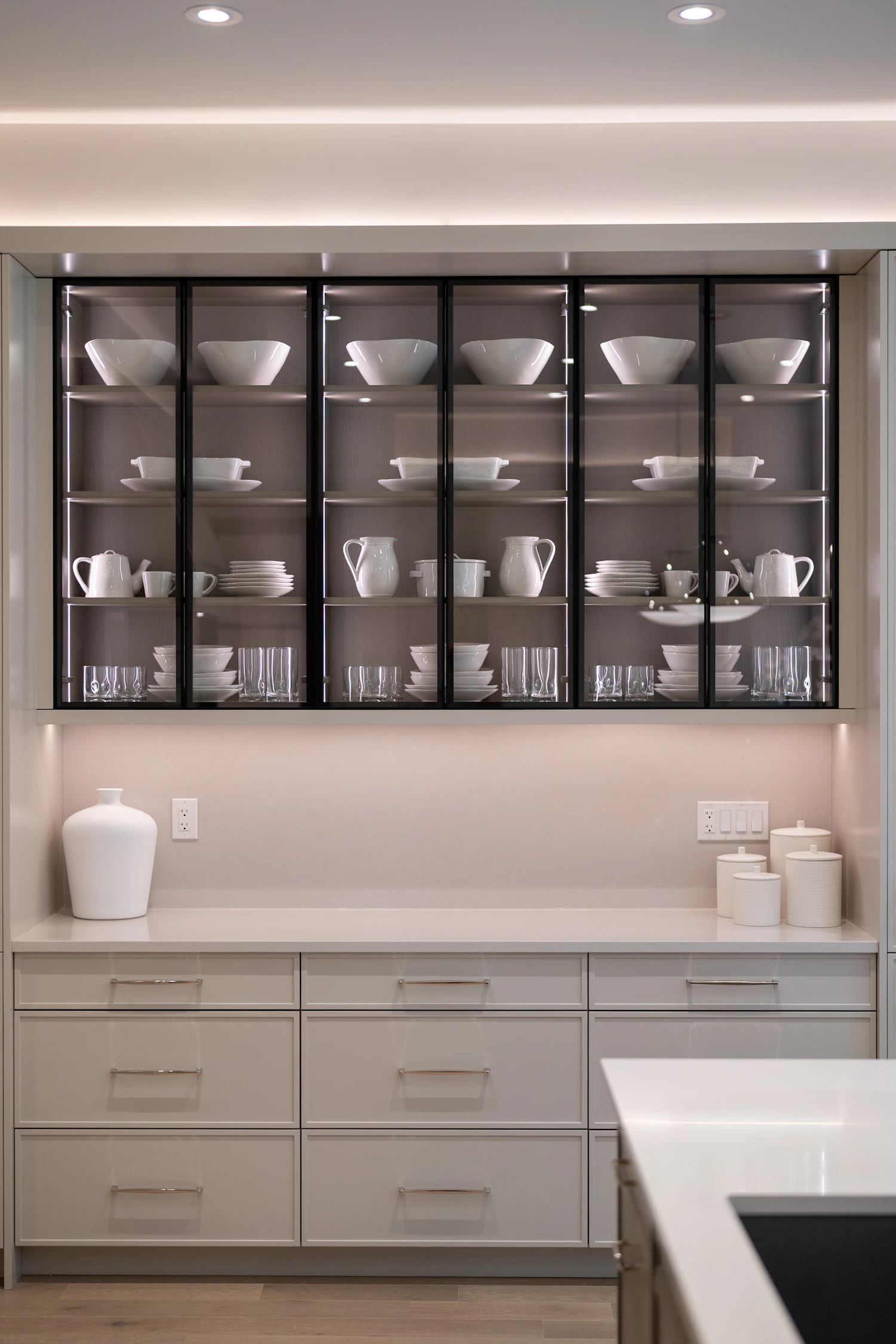 Modern display cabinet with dishes and glassware, shown as cabinetry detail inspiration