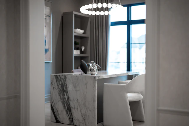 Modern office with marble desk and plush chair