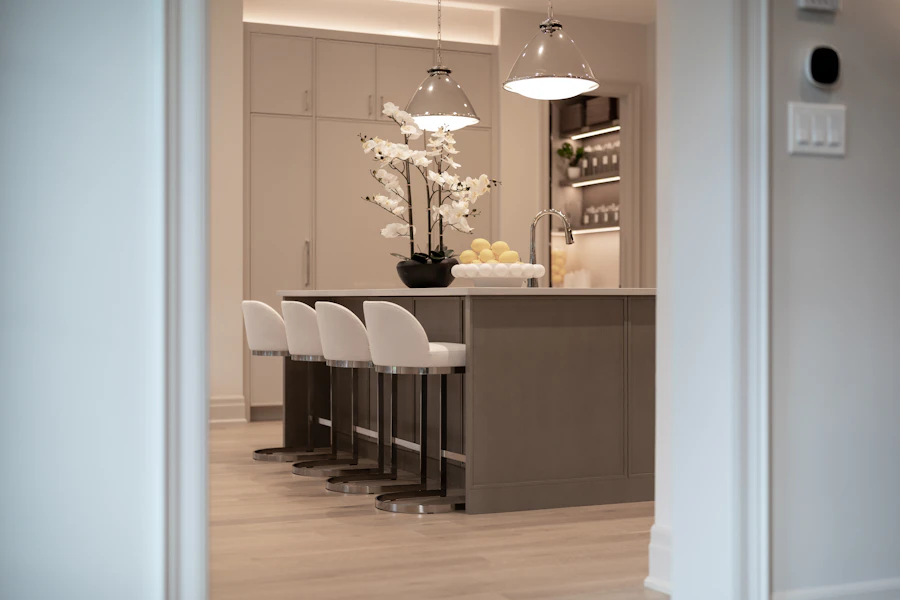 Modern kitchen island with white bar stools