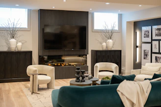 Modern living room with fireplace and comfortable seating.