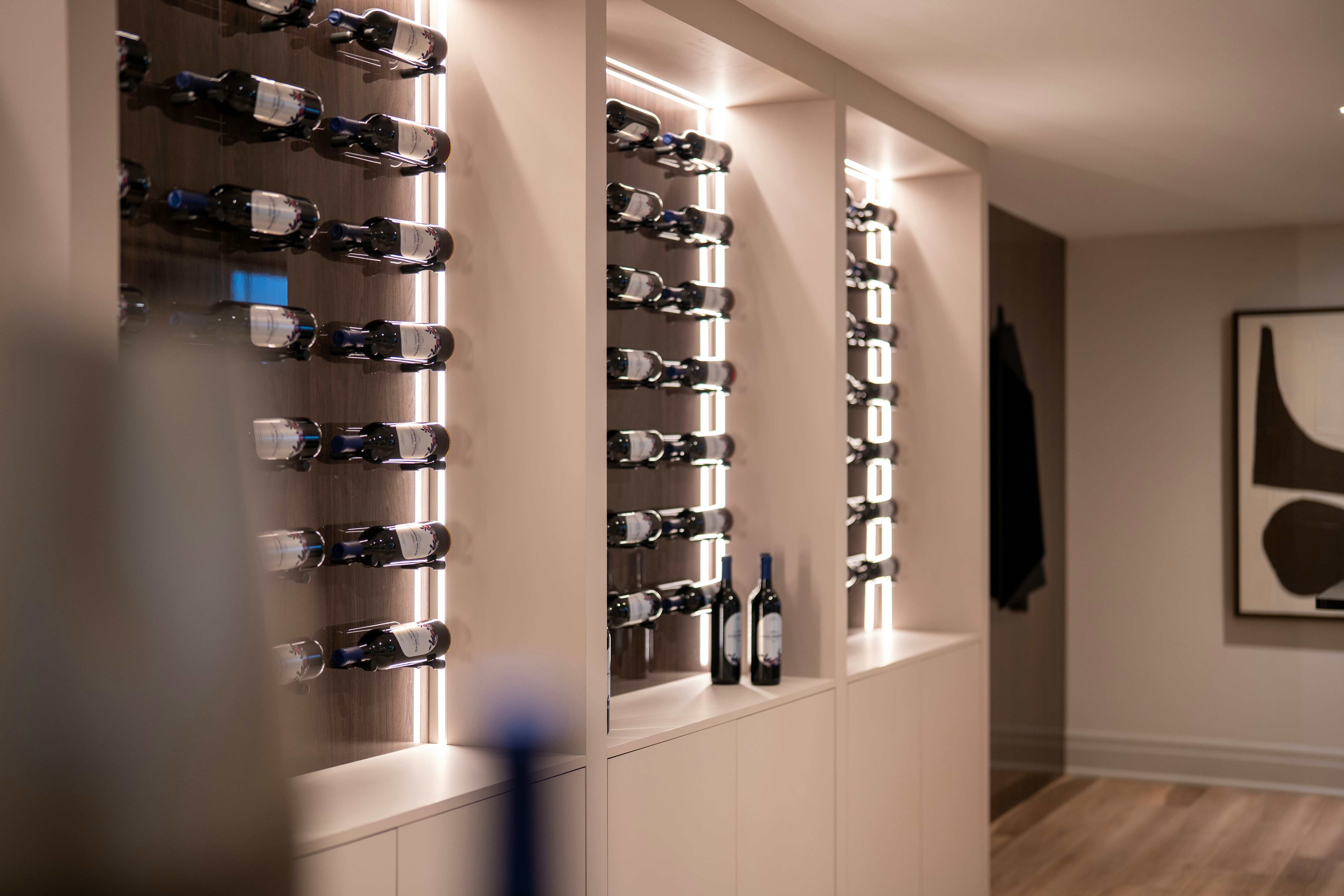 Modern wine cellar with illuminated shelves and bottles