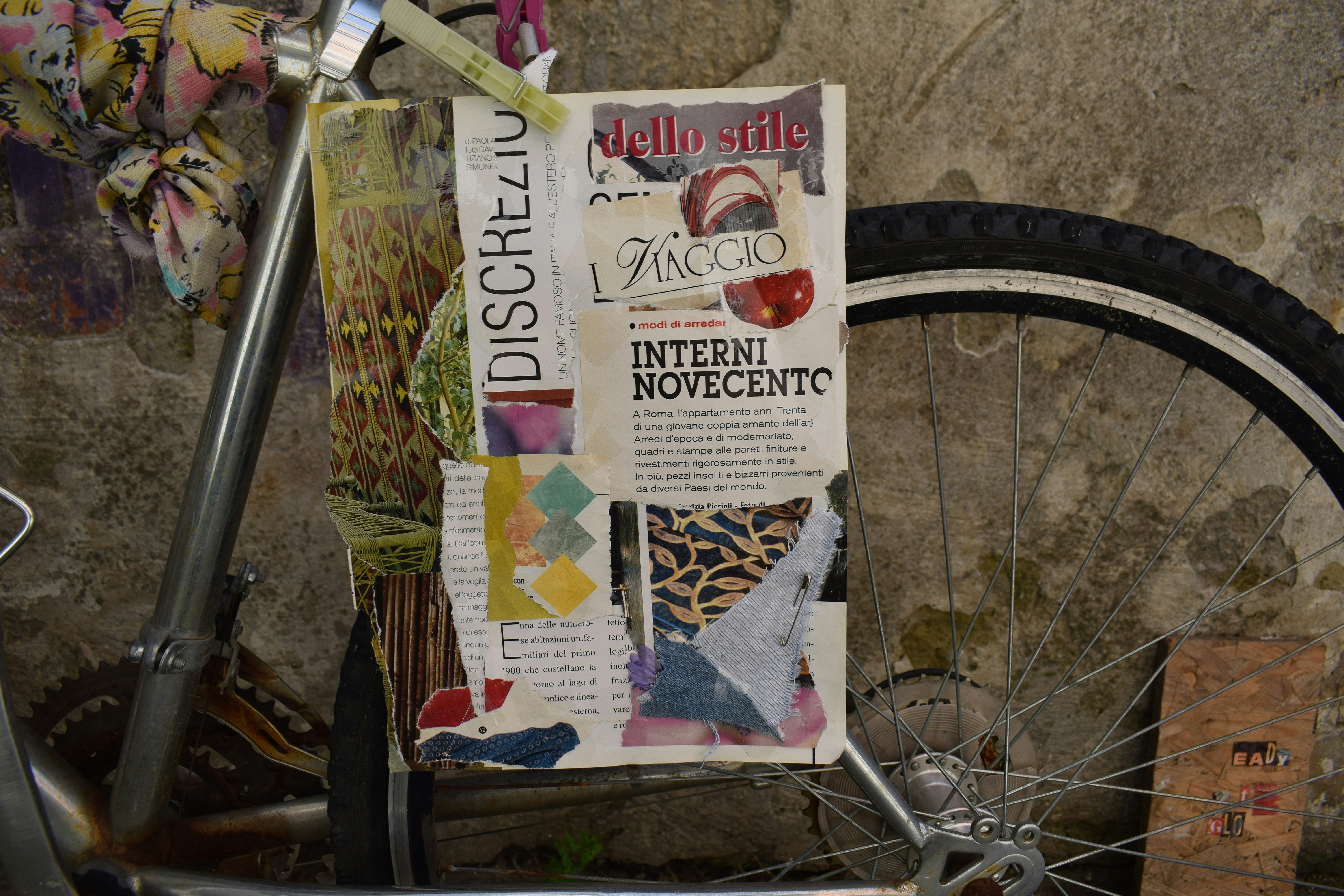 Collage on bicycle with rustic wall background