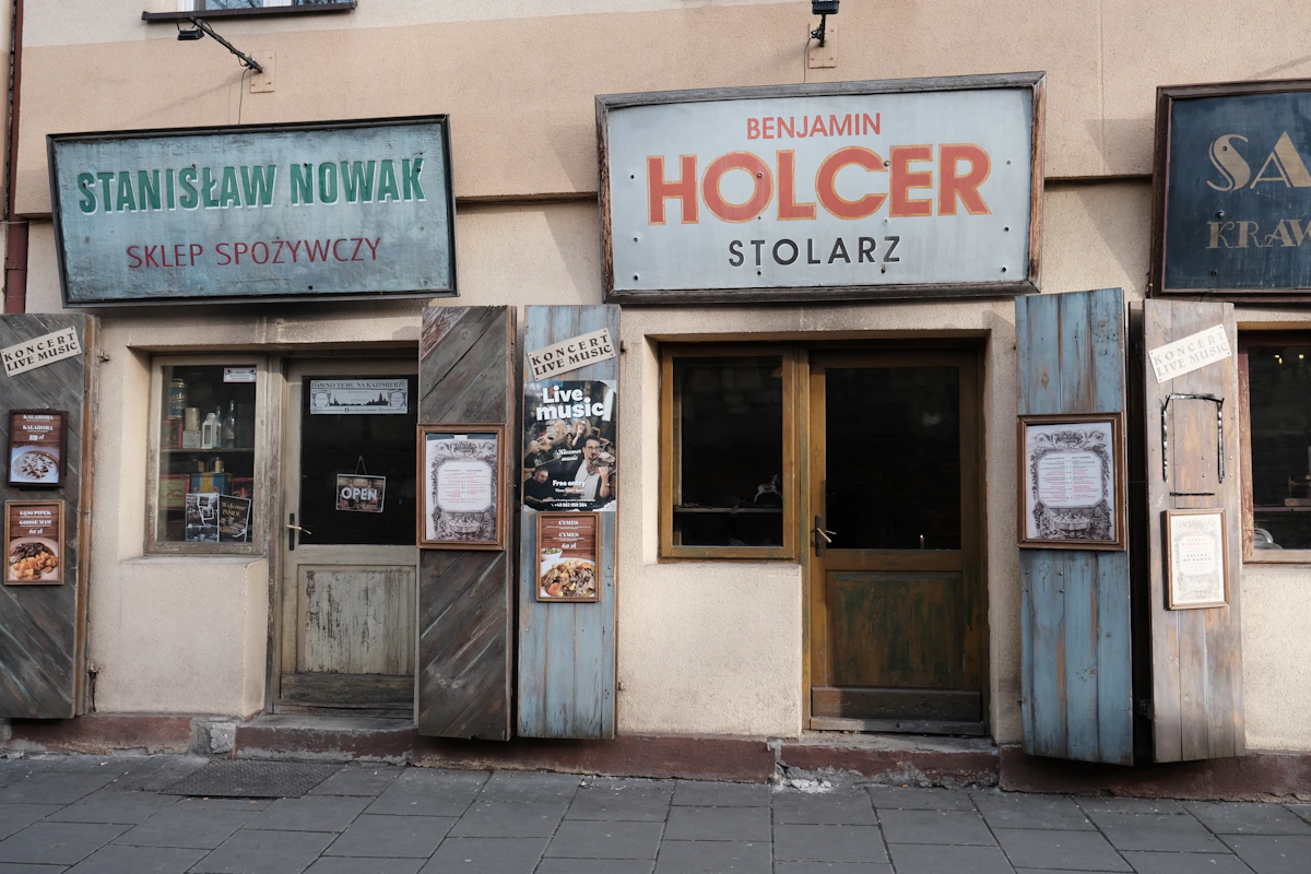 Old shopfronts with hand-painted Polish signs in Kazimierz, Kraków