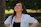 A young woman smiling and looking up outdoors