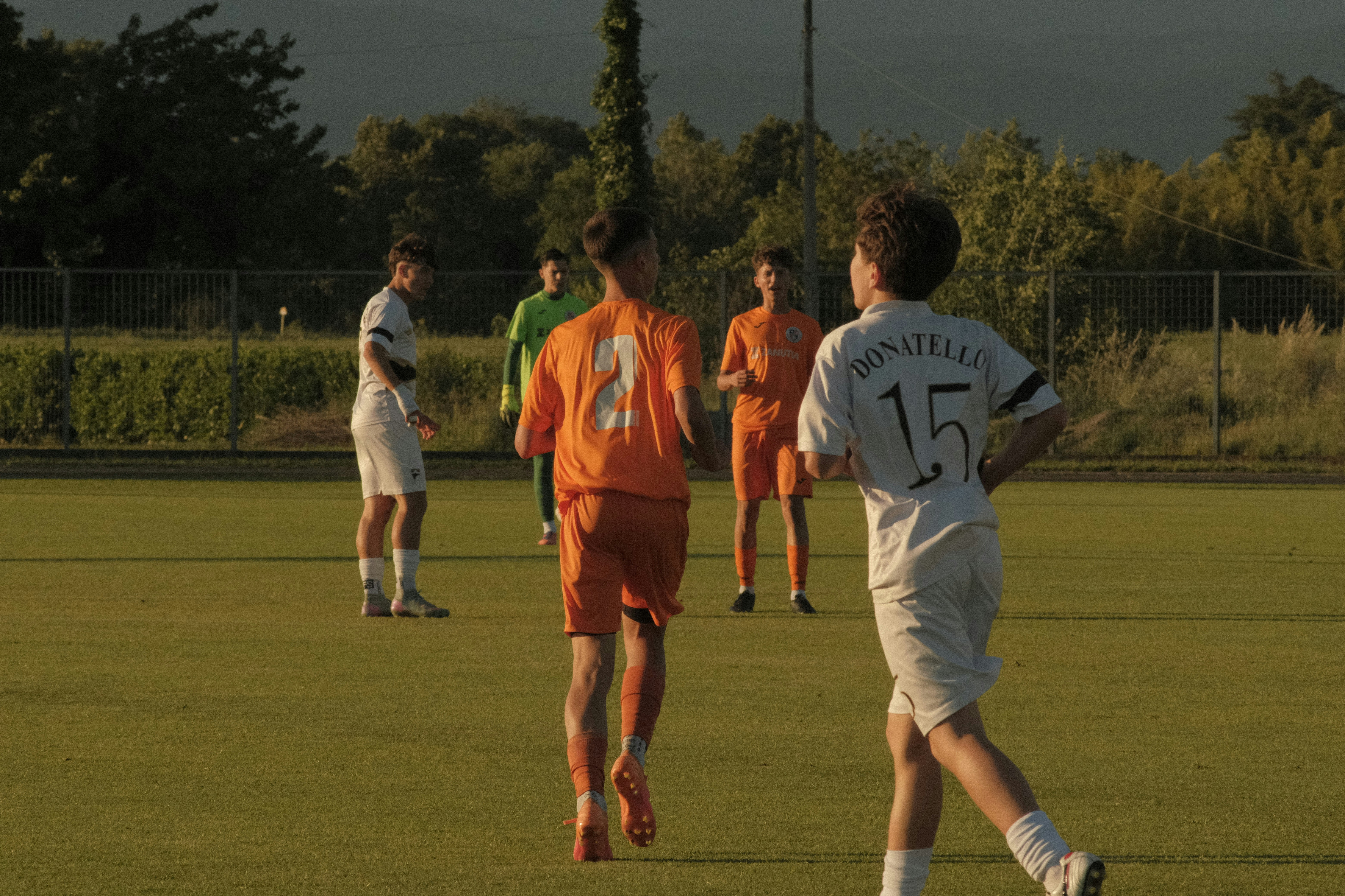 Young soccer players on a grassy field