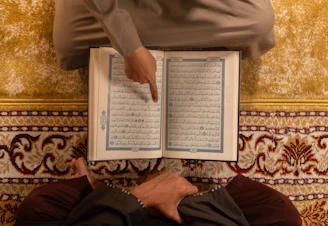 Two people reading the quran together