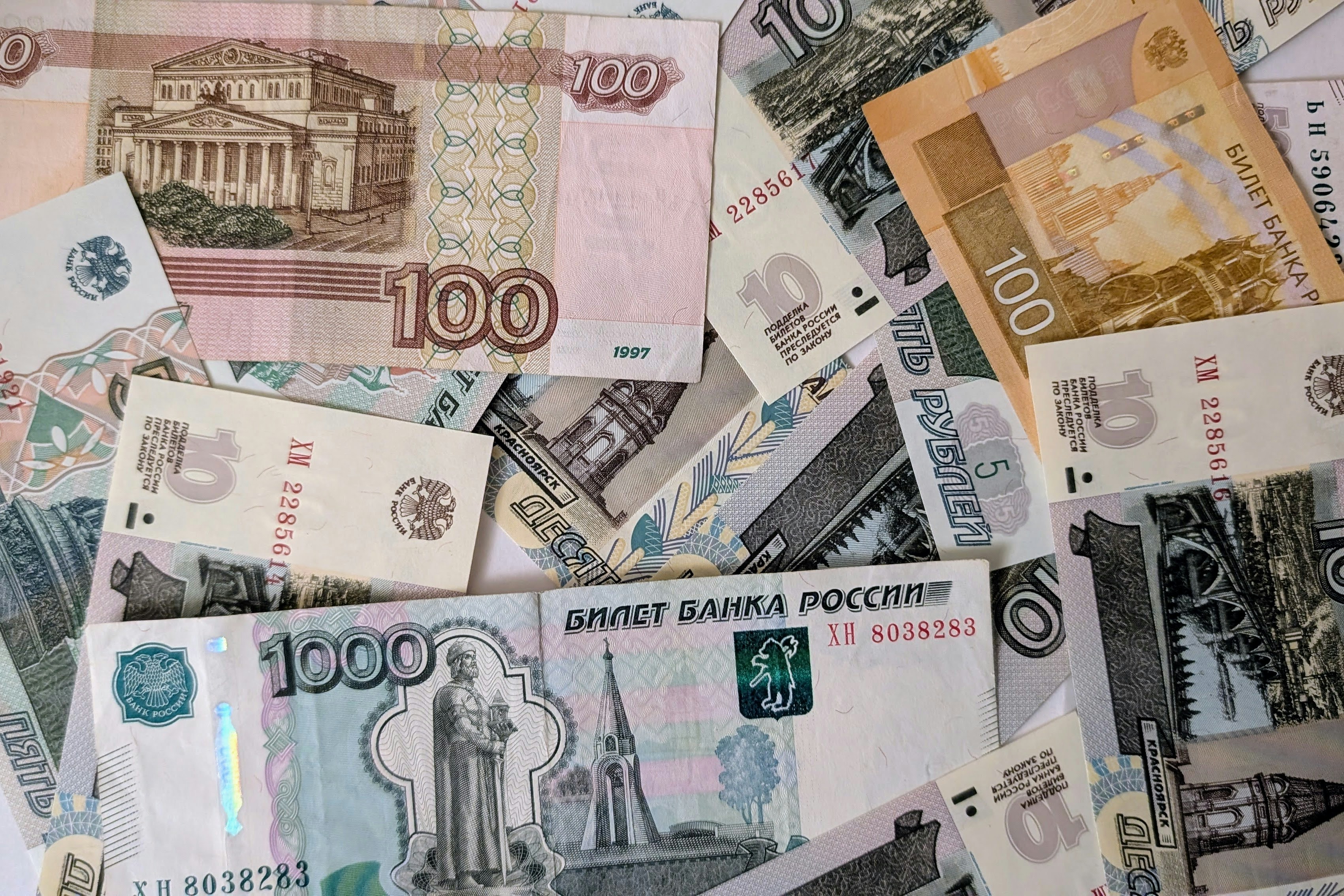 Russian Roubles - 5, 10, 100, 1000 Rouble banknotes mixed, view from above.