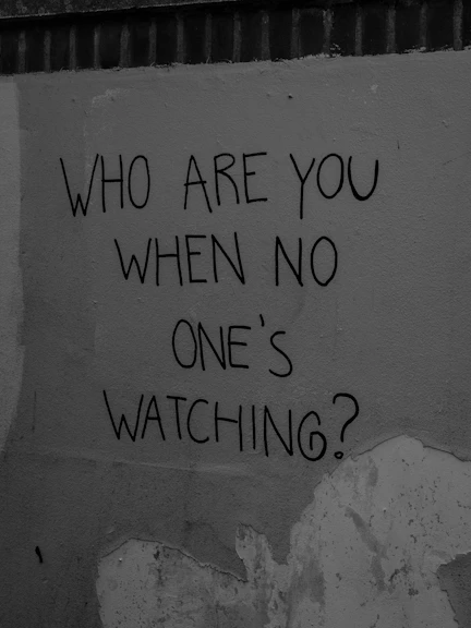 Graffiti asking "who are you when no one's watching?"