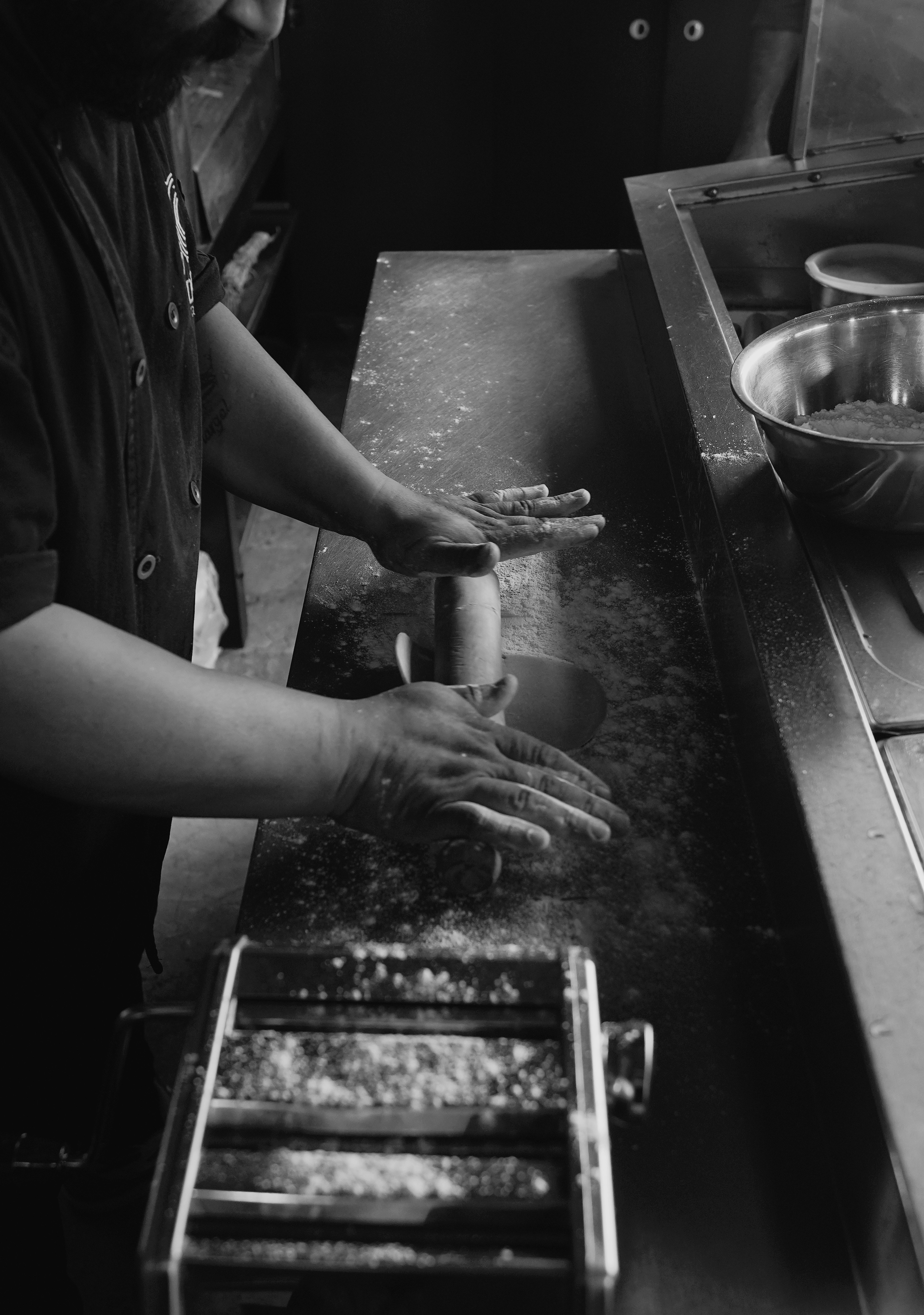 Chef making pasta with a machine