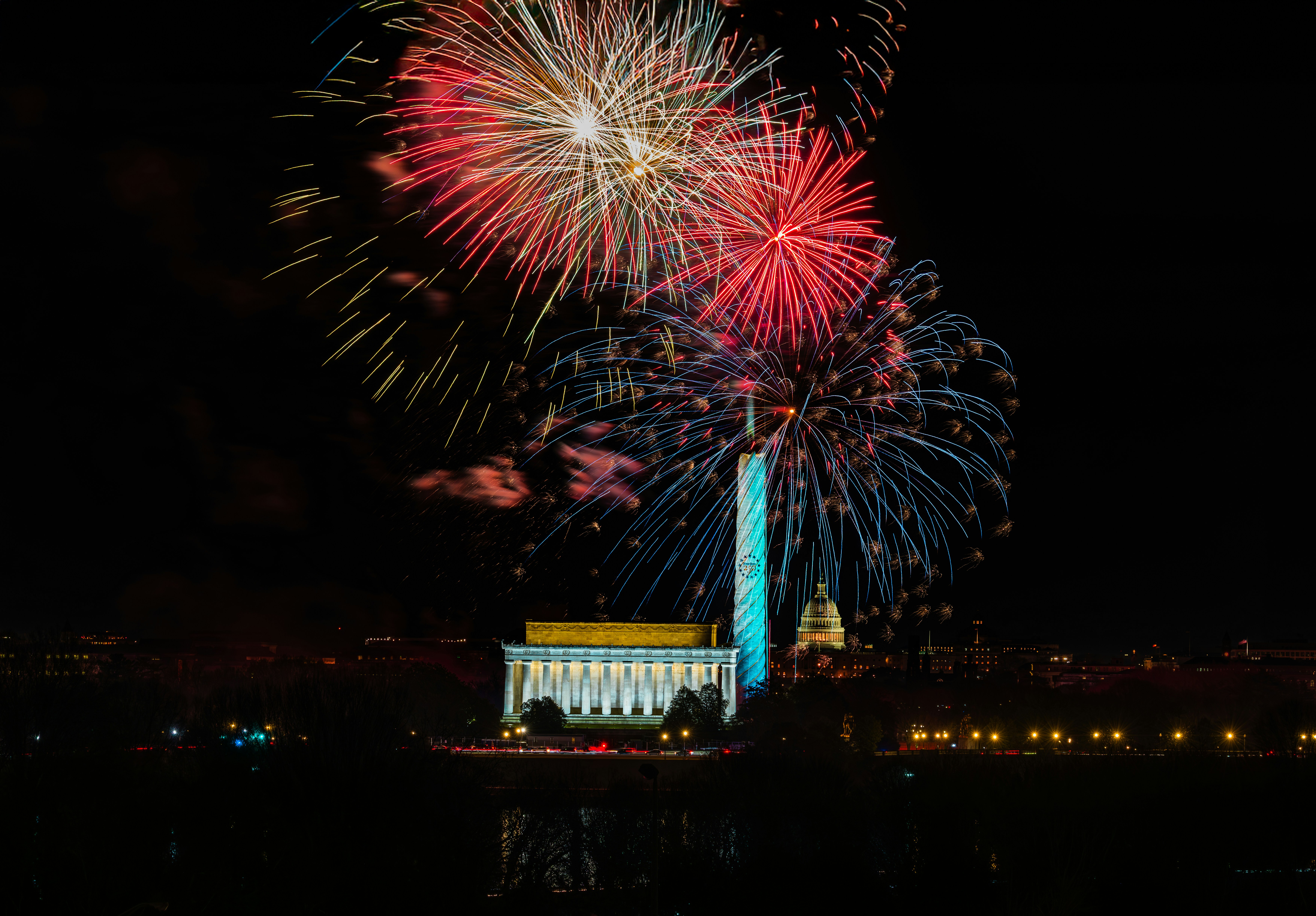 fireworks display night sky American flag patriotic colors
