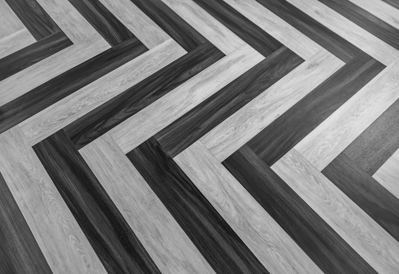 Grey herringbone flooring laid in a neat pattern