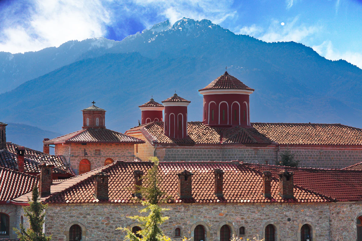 Clifftop monastery with red roofs in Meteora, Greece