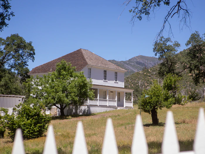 Acreage home with wide verandah surrounded by open land.