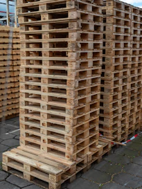 Stacks of wooden shipping pallets outdoors