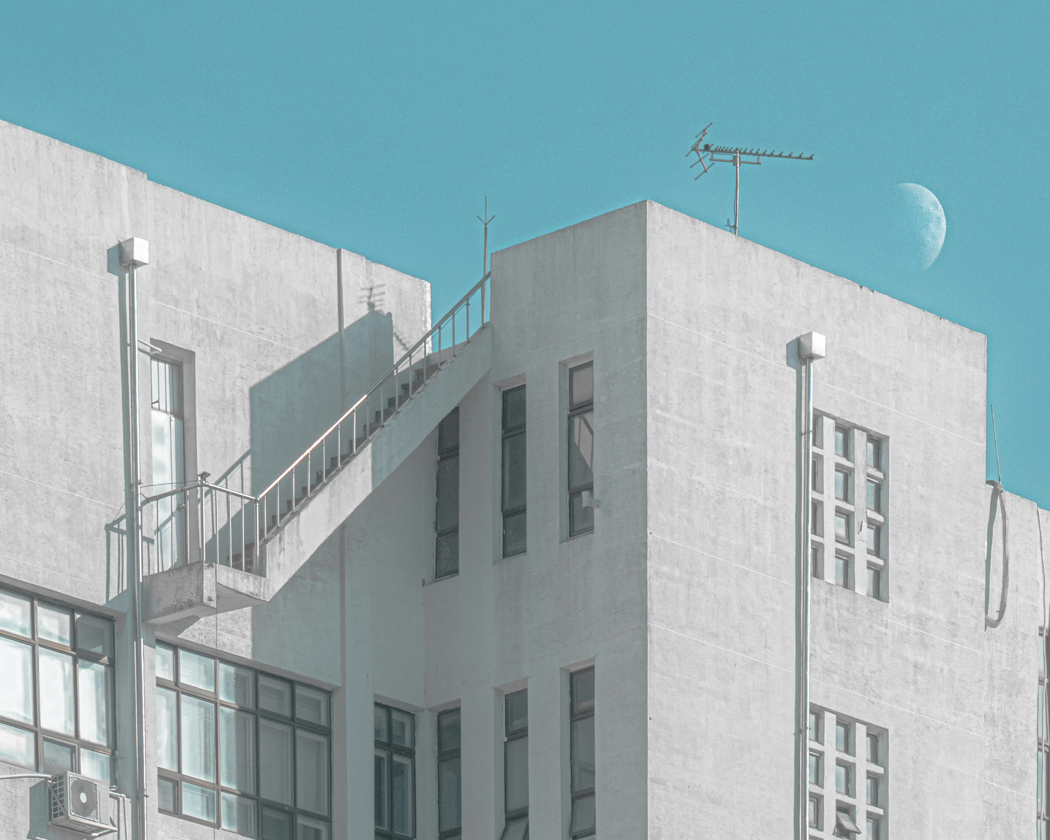 Modern building with a crescent moon in the sky