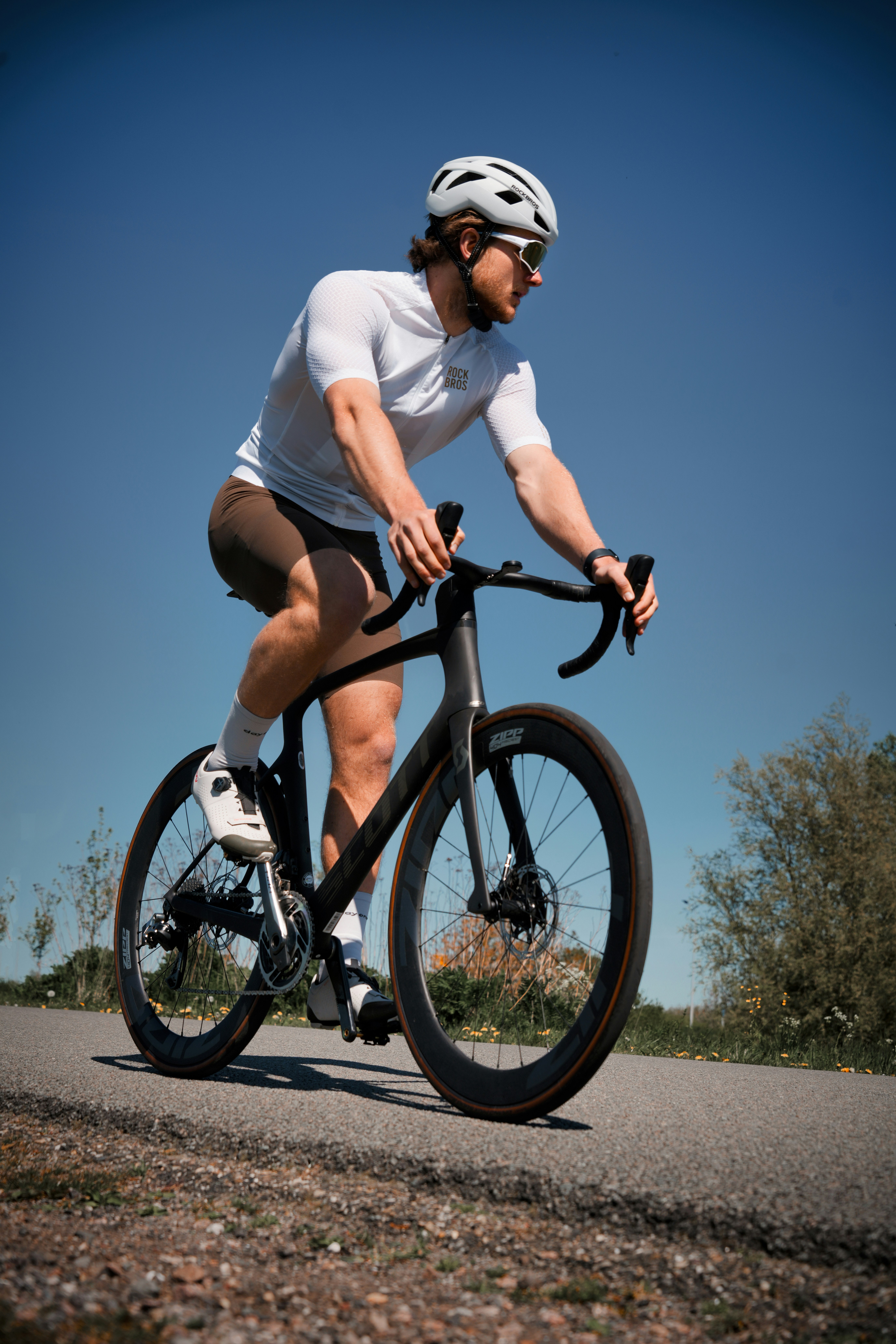 Man riding a bicycle on a sunny day