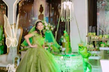 Young woman in vibrant green gown at a festive event