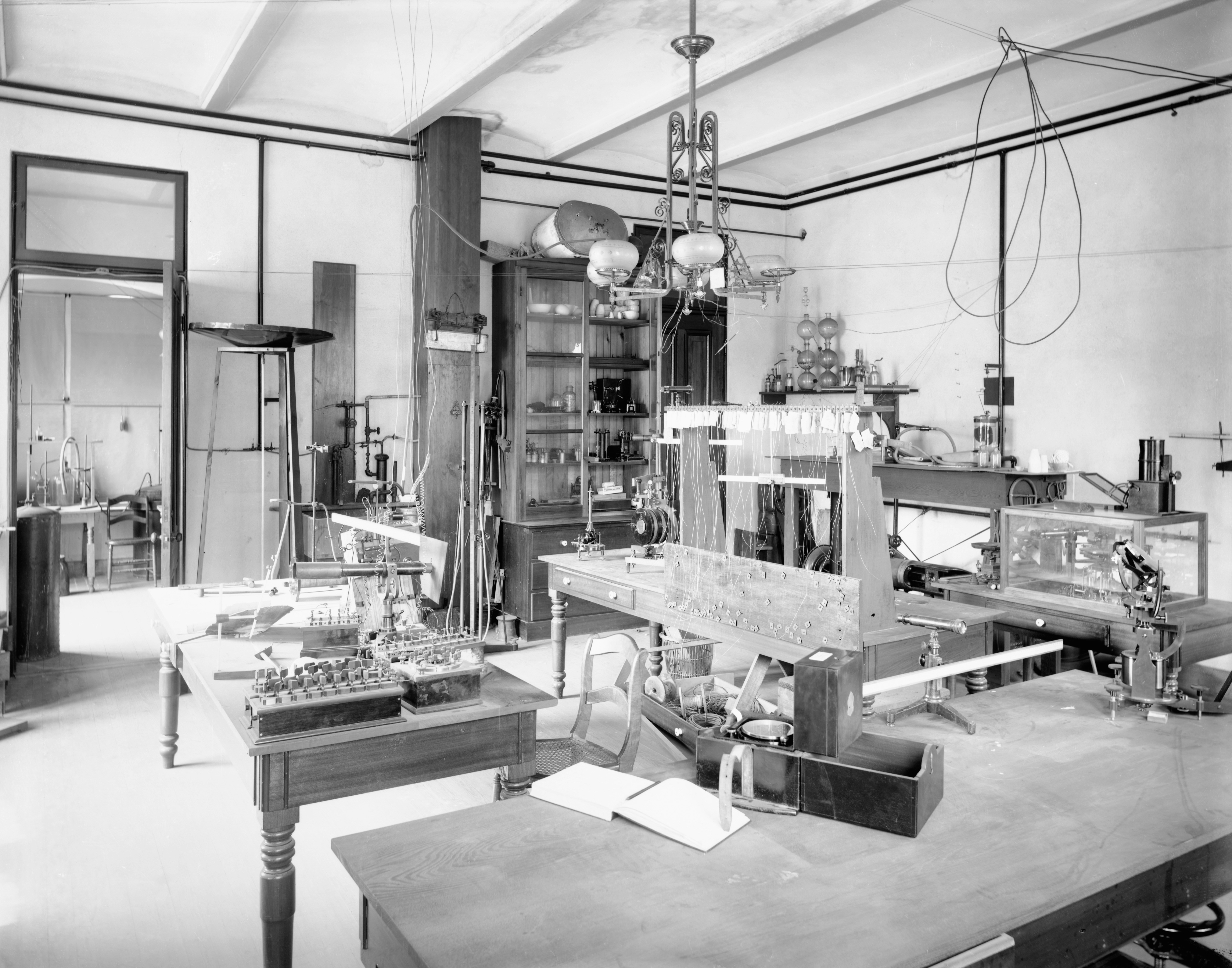 A vintage laboratory with scientific equipment and tables.