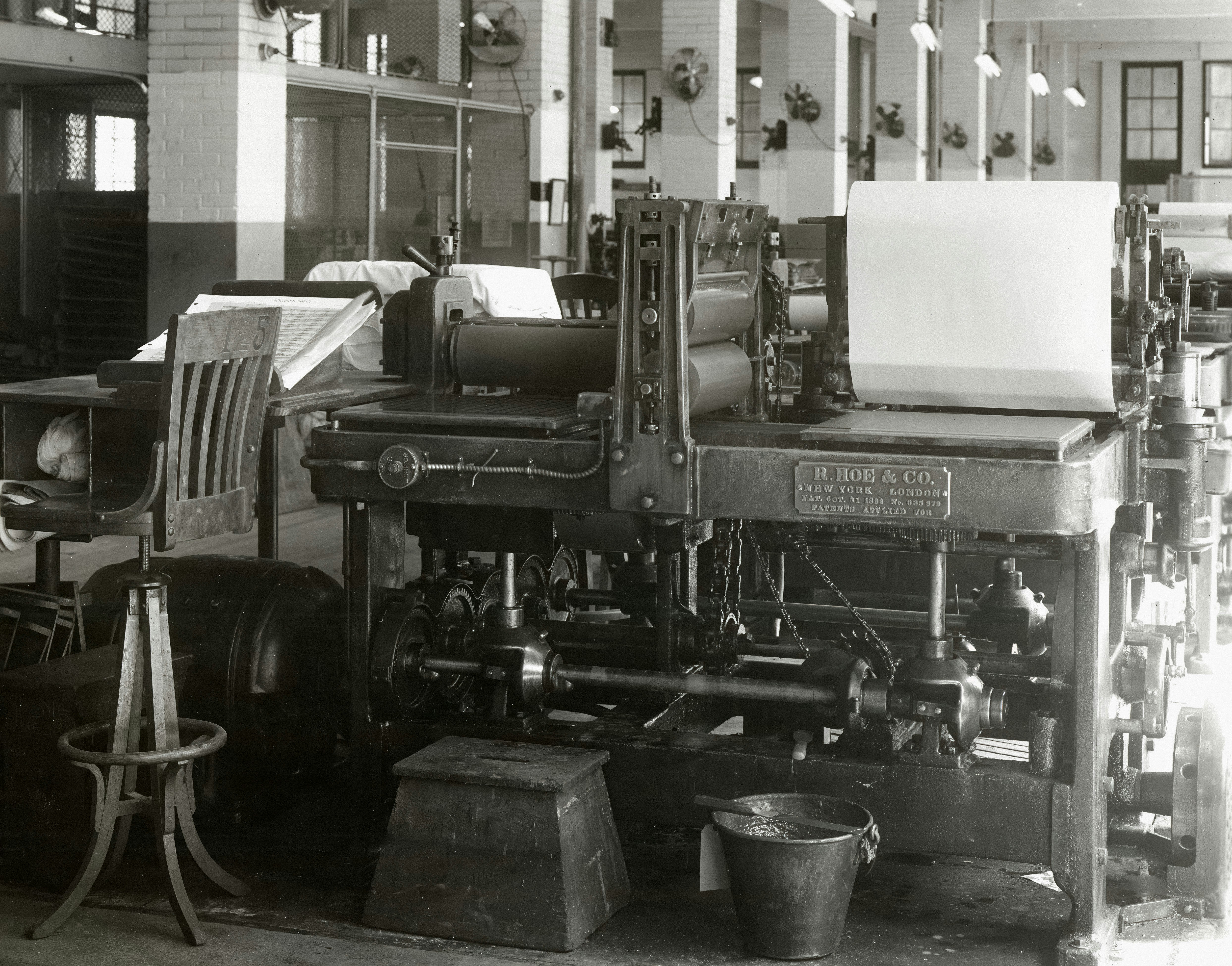 19th-century newspaper printing press in operation