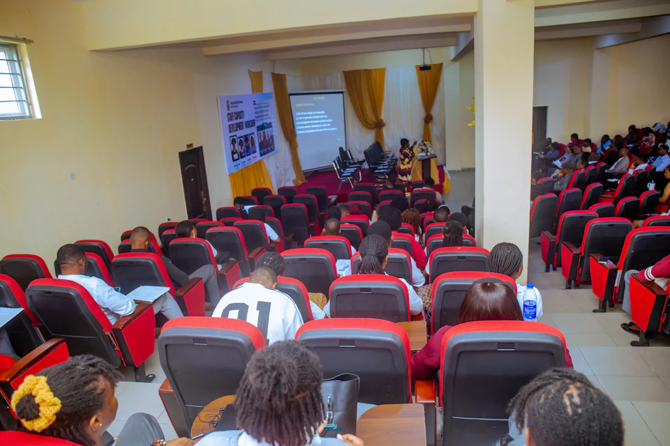 Audience attending a lecture in a large hall