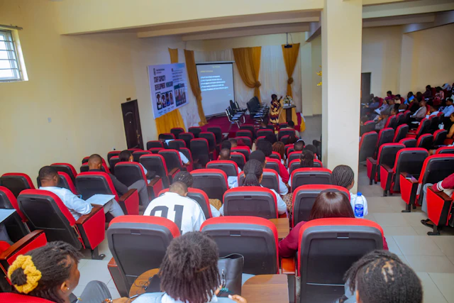 Institutional cohort seated in a training hall