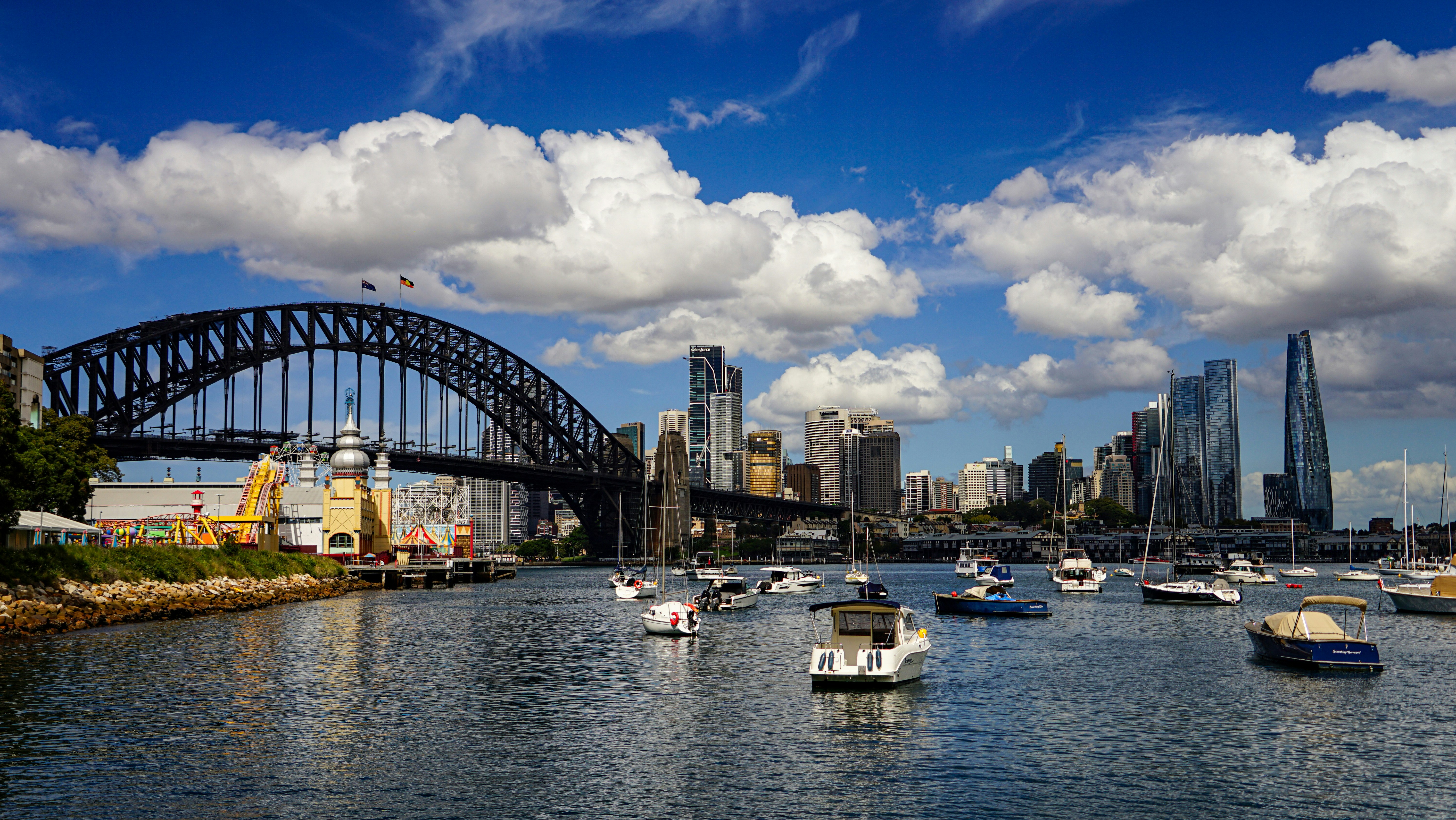 Boats on the water with sydney harbour bridge and skyline.