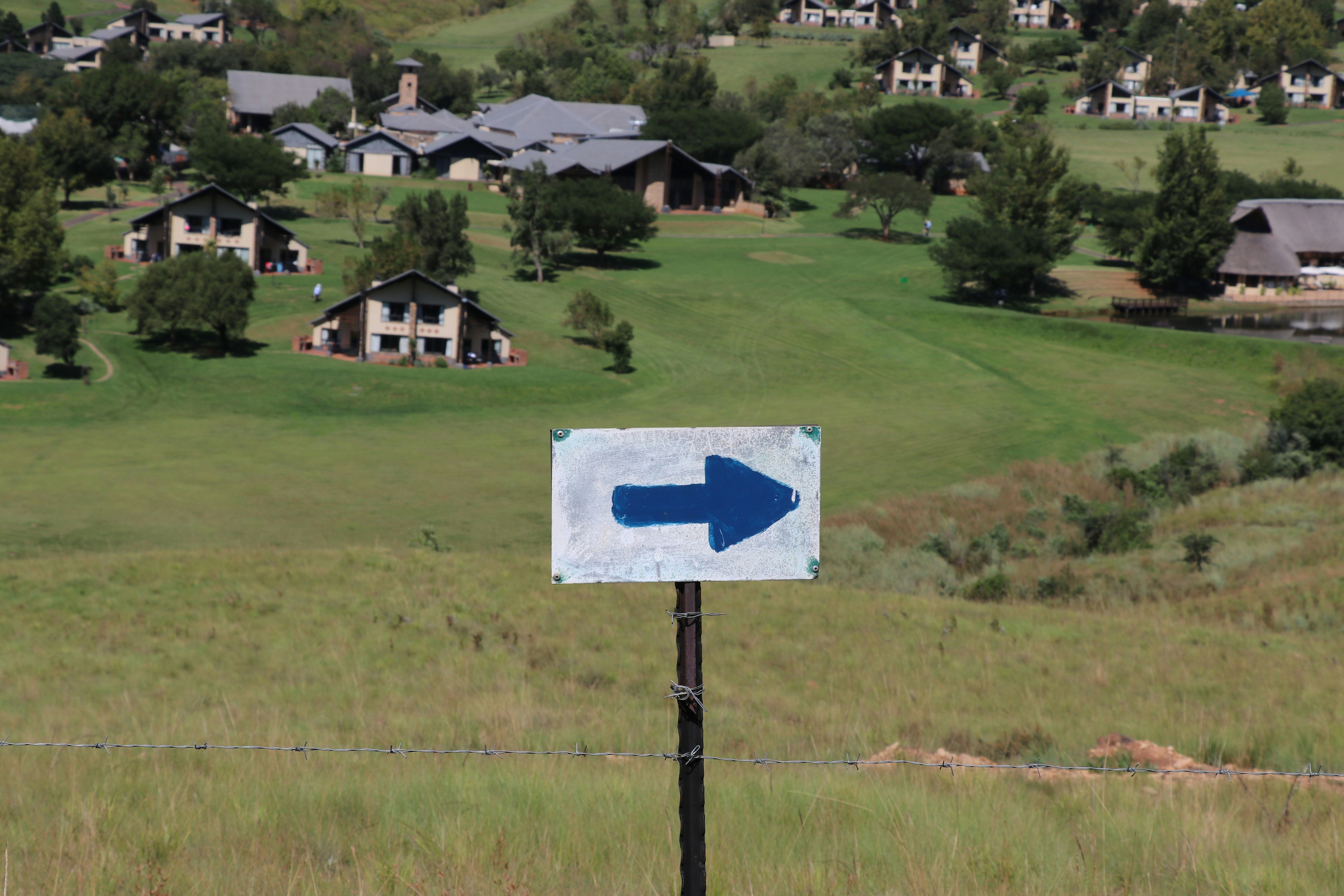 A blue arrow sign points to the right.