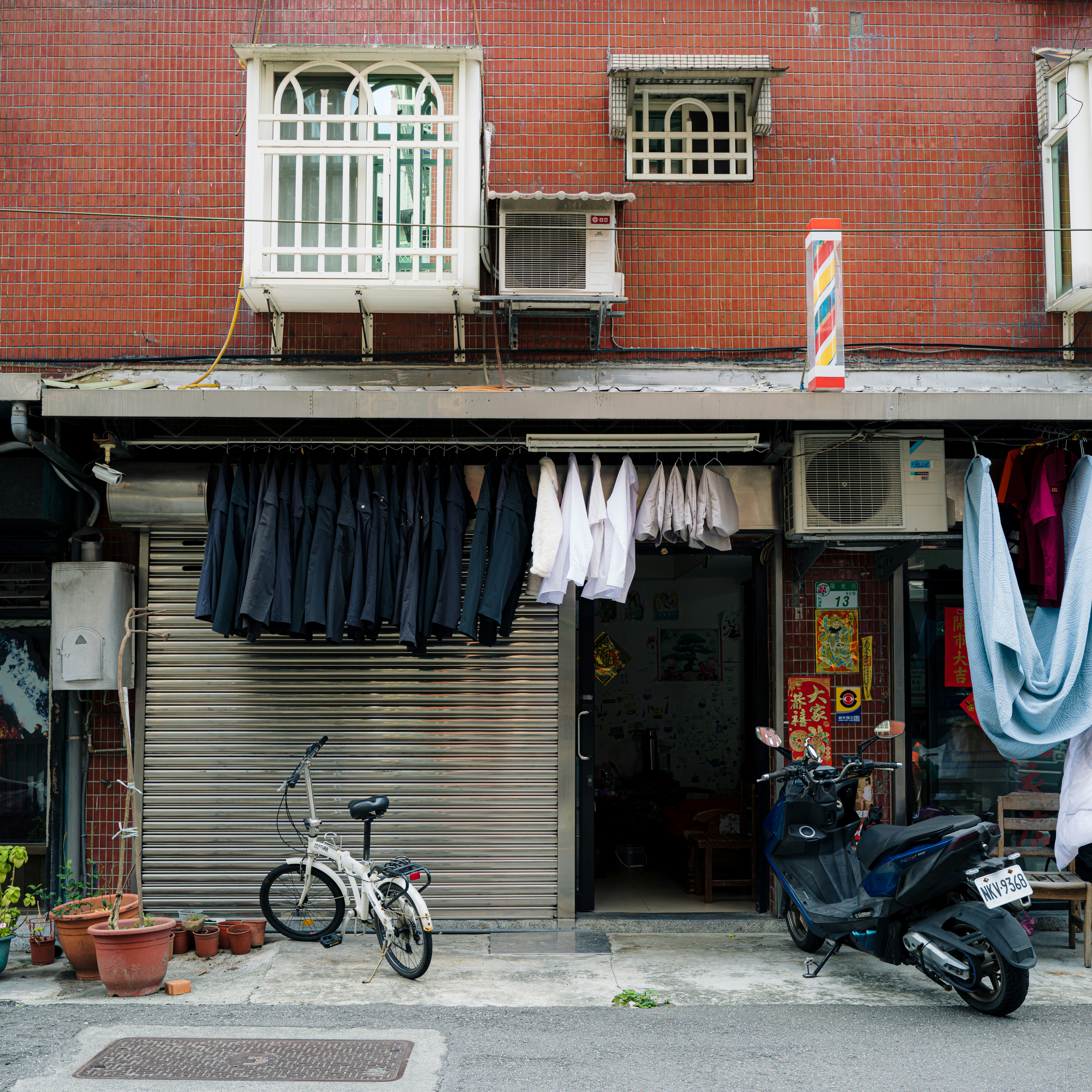 Apartment building facade with laundry hanging outside.