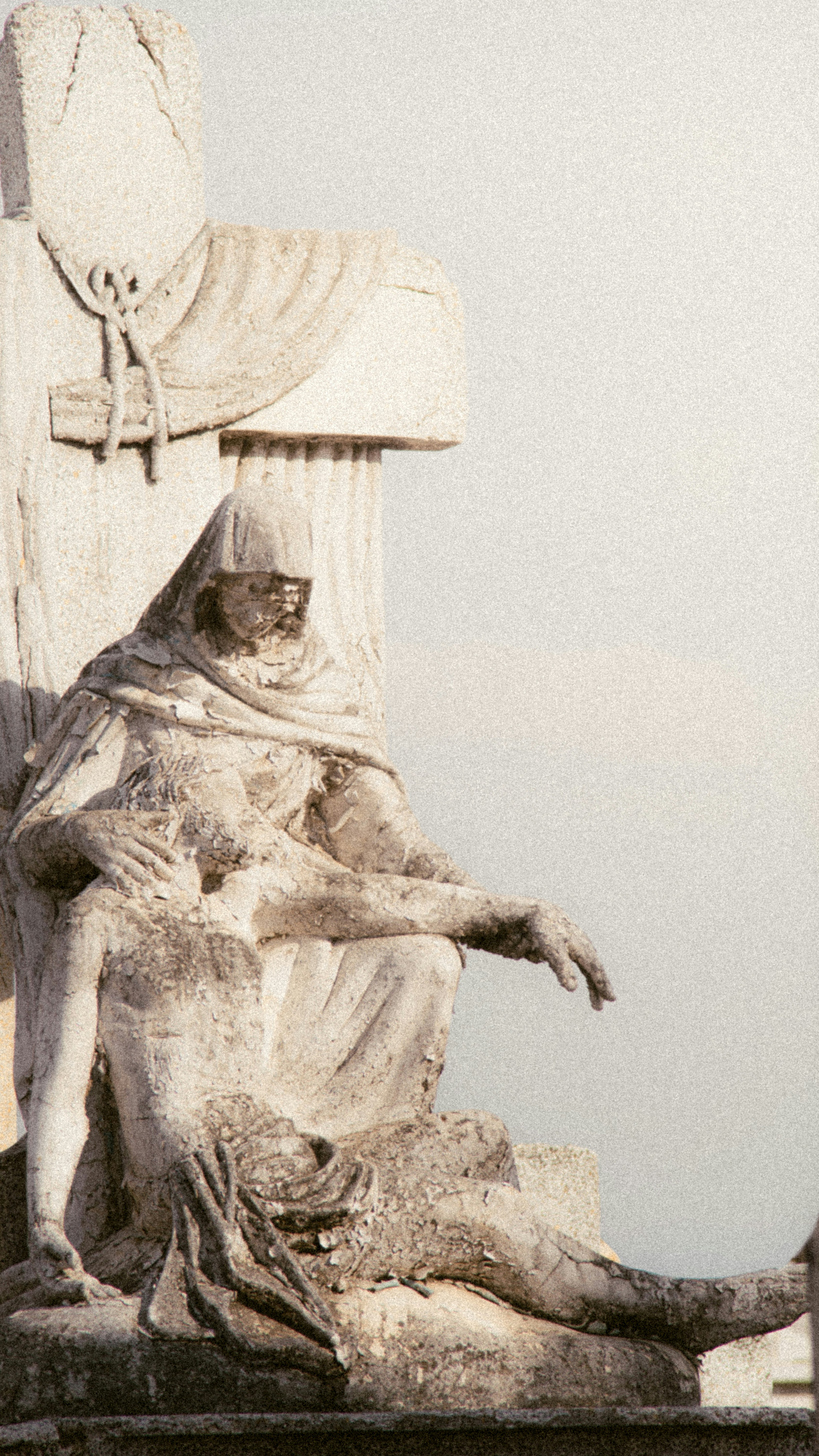 Stone sculpture of mary holding the body of jesus