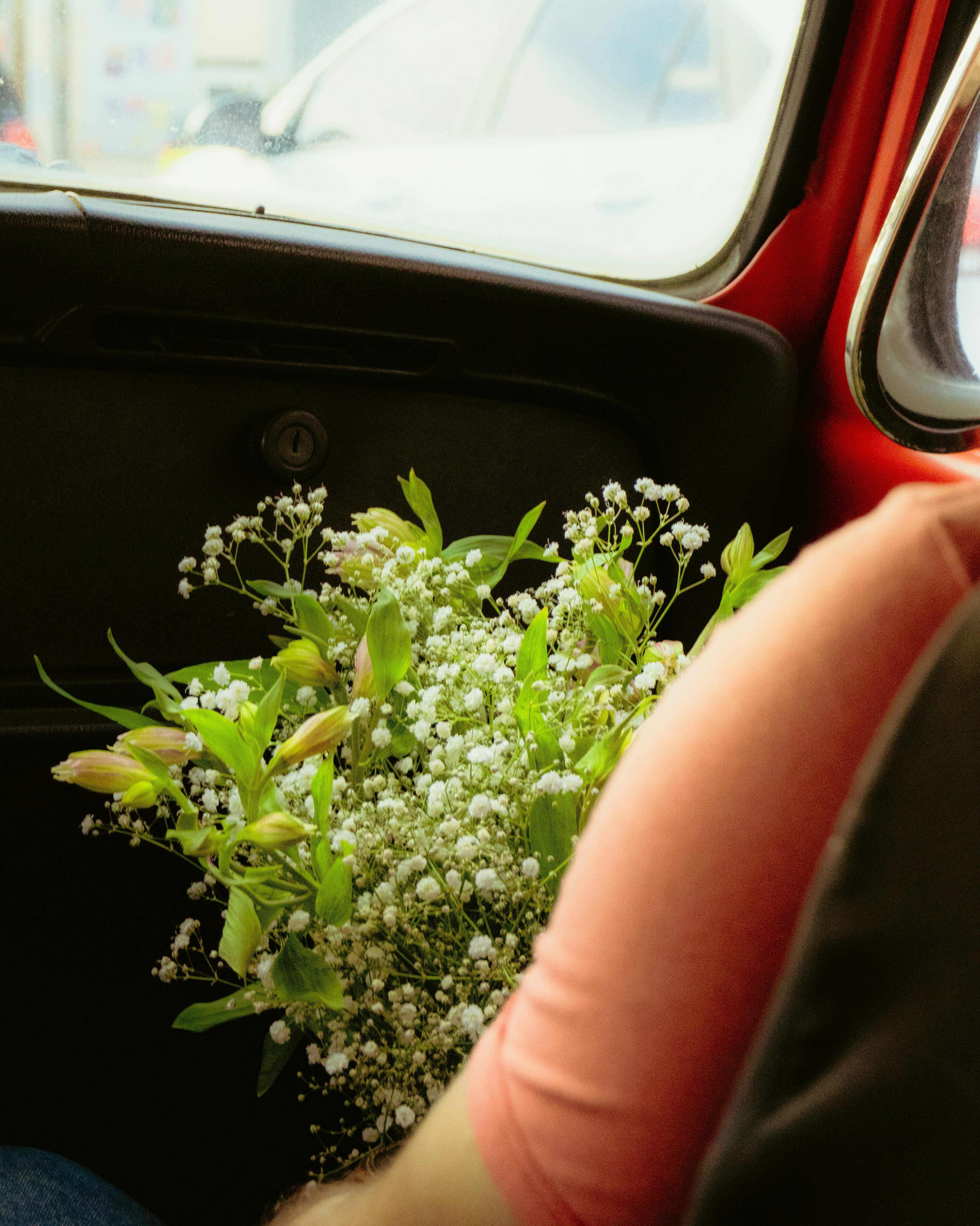 A bouquet of small white flowers and greenery