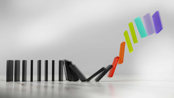 Colorful dominoes falling in a chain reaction