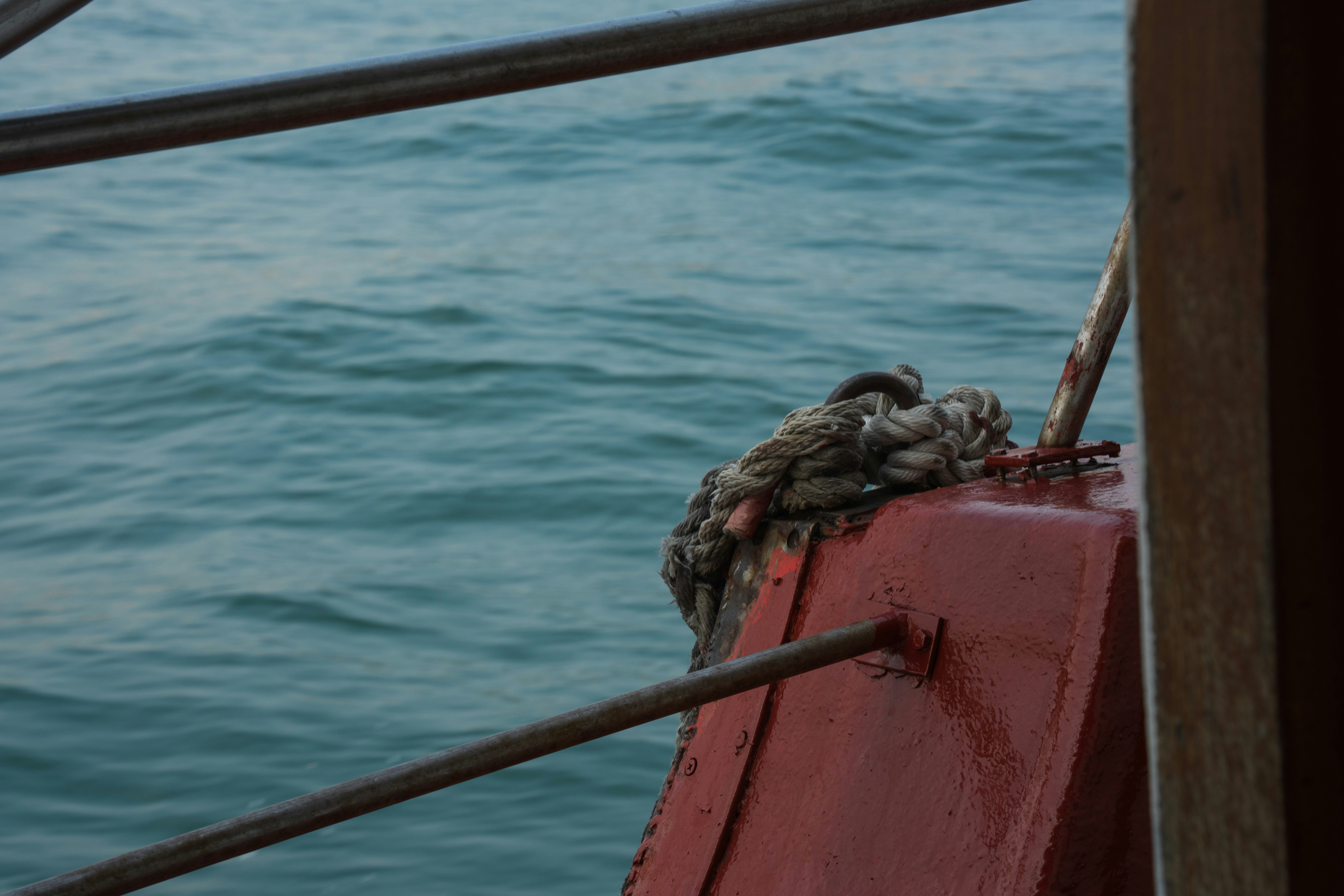 Thick rope tied to a boat railing