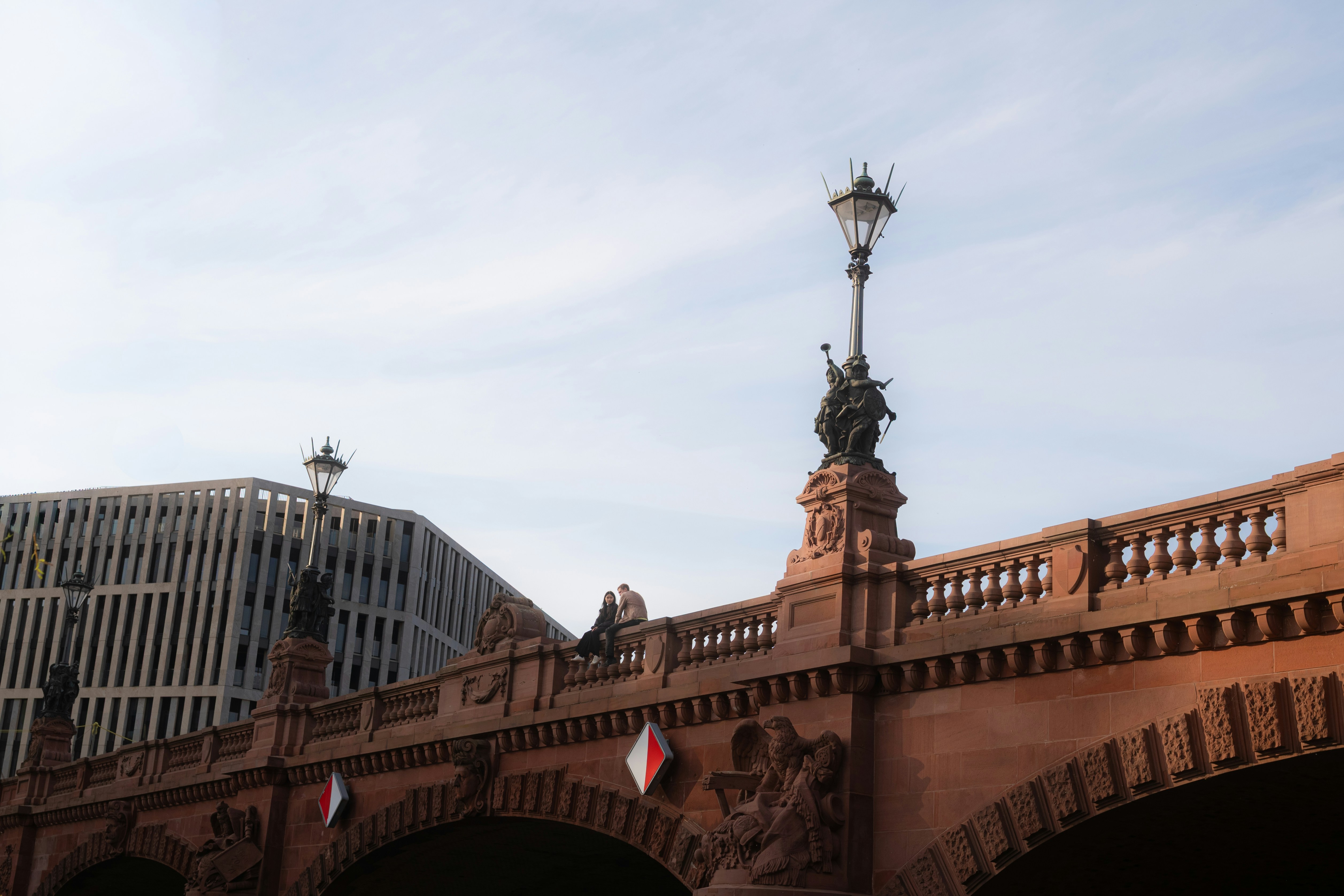 Ornate bridge with modern building in background